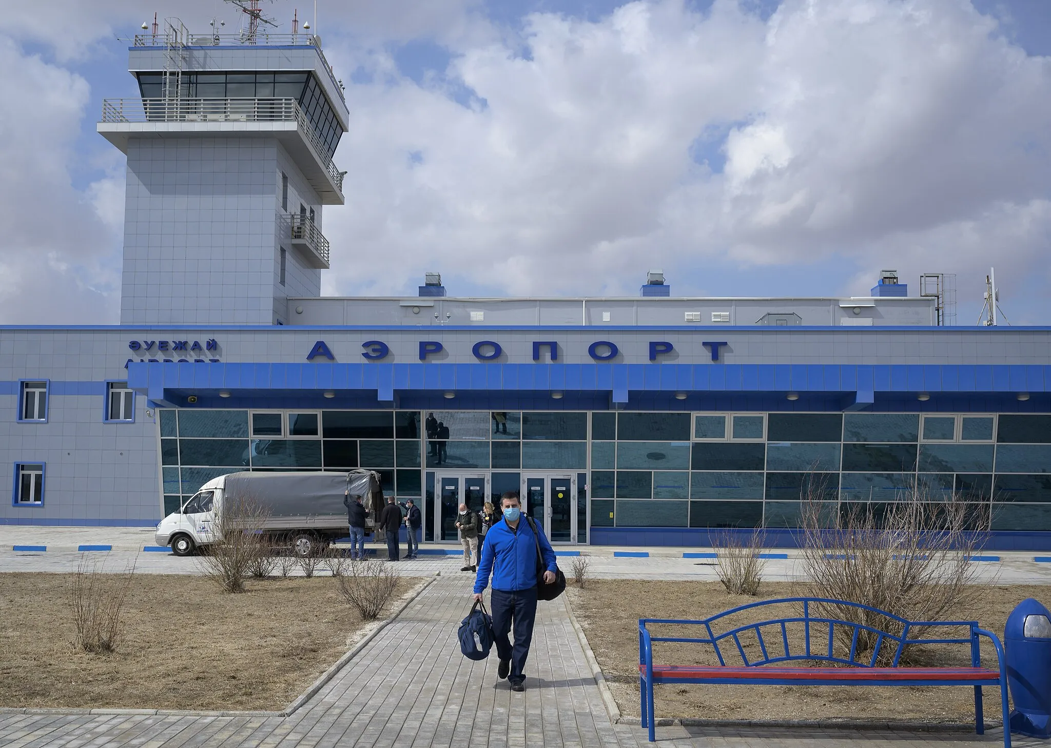 Photo showing: NASA ISS Program Manager Joel Montalbano and other NASA team members arrive at the Krayniy Airport in Baikonur, Kazakhstan in advance of the launch of Expedition 65 crewmembers Mark Vande Hei of NASA, Pyotr Dubrov and Oleg Novitskiy of Roscosmos, Monday, April 5, 2021. Vande Hei, Dubrov, and Novitskiy are scheduled to launch aboard their Soyuz MS-18 spacecraft on April 9. Photo Credit: (NASA/Bill Ingalls)