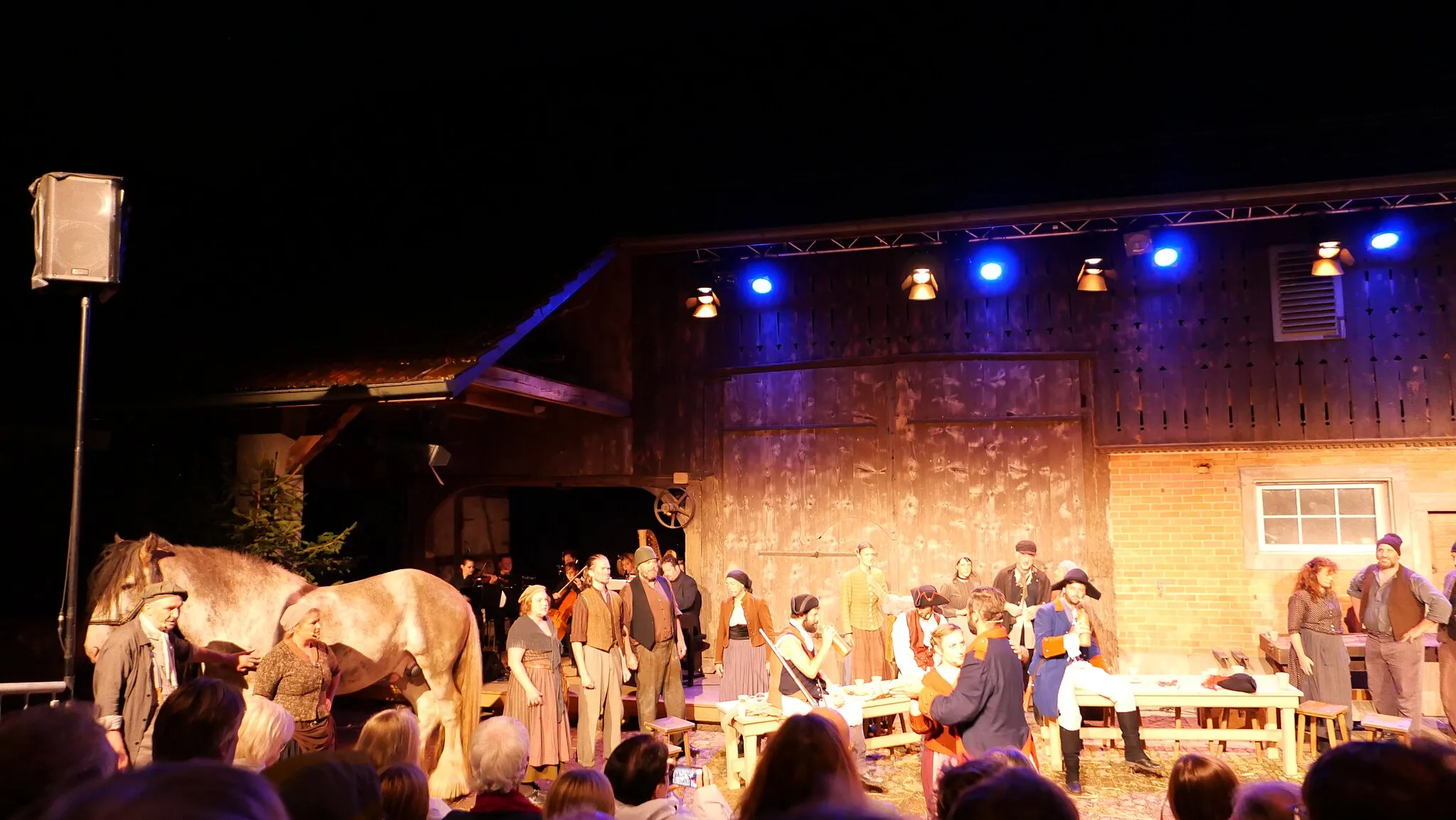 Photo showing: The opening night of the musical "The Tigress of Weiach" about the local battles of the French Revolutionary Wars in 1799/1800. The production was commissioned by the municipality of Weiach in the canton of Zurich (Switzerland) to celebrate the 750th anniversary of the first documentary mention of the village. Script written by Mathias Reiter, music composed by Raimund Wiederkehr and play directed by Jeannot Hunziker.