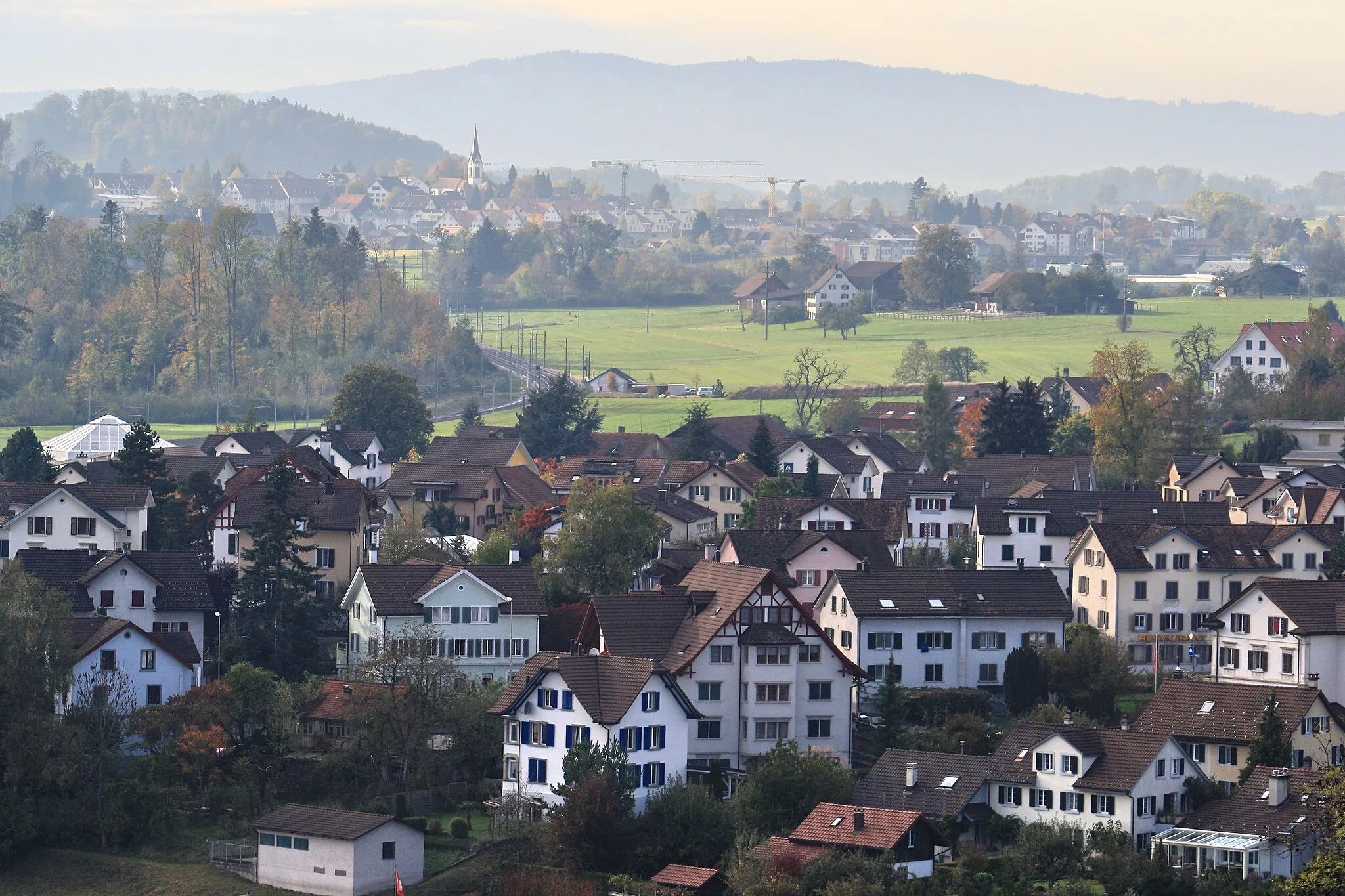 Photo showing: Tann-Rüti, as seen from Haltberg in Rüti (ZH), Pfannenstiel in the background.
