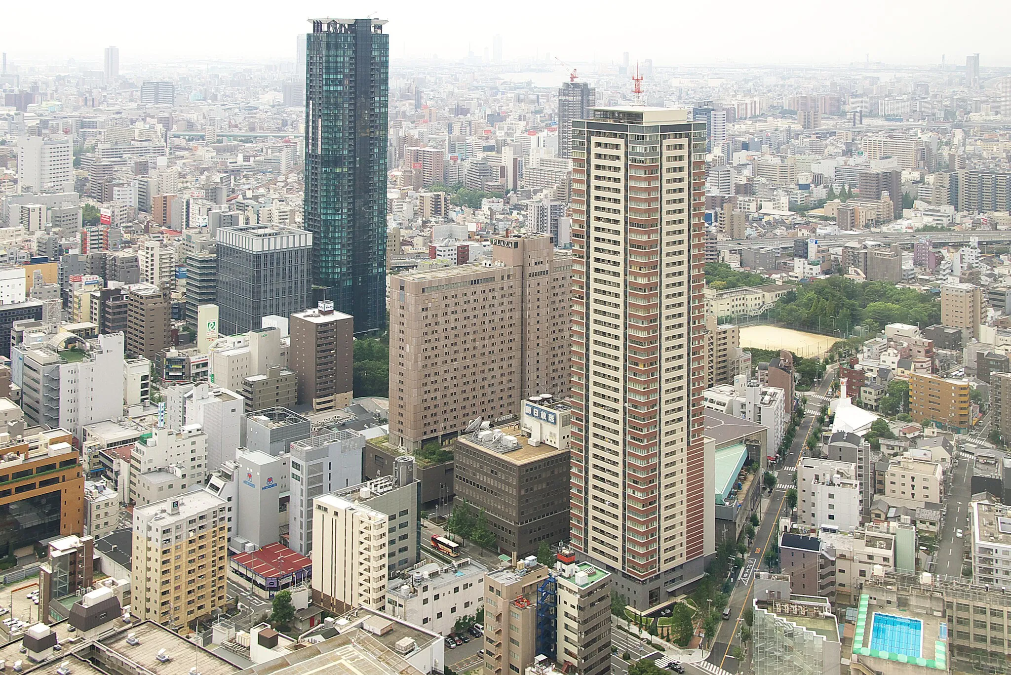 Photo showing: Photograph of aerial view of ABC Center, including the former headquarters of Asahi Broadcasting Corporation, in Kita-ku, Osaka, Osaka Prefecture, Japan, taken from the observation deck of Umeda Sky Building.