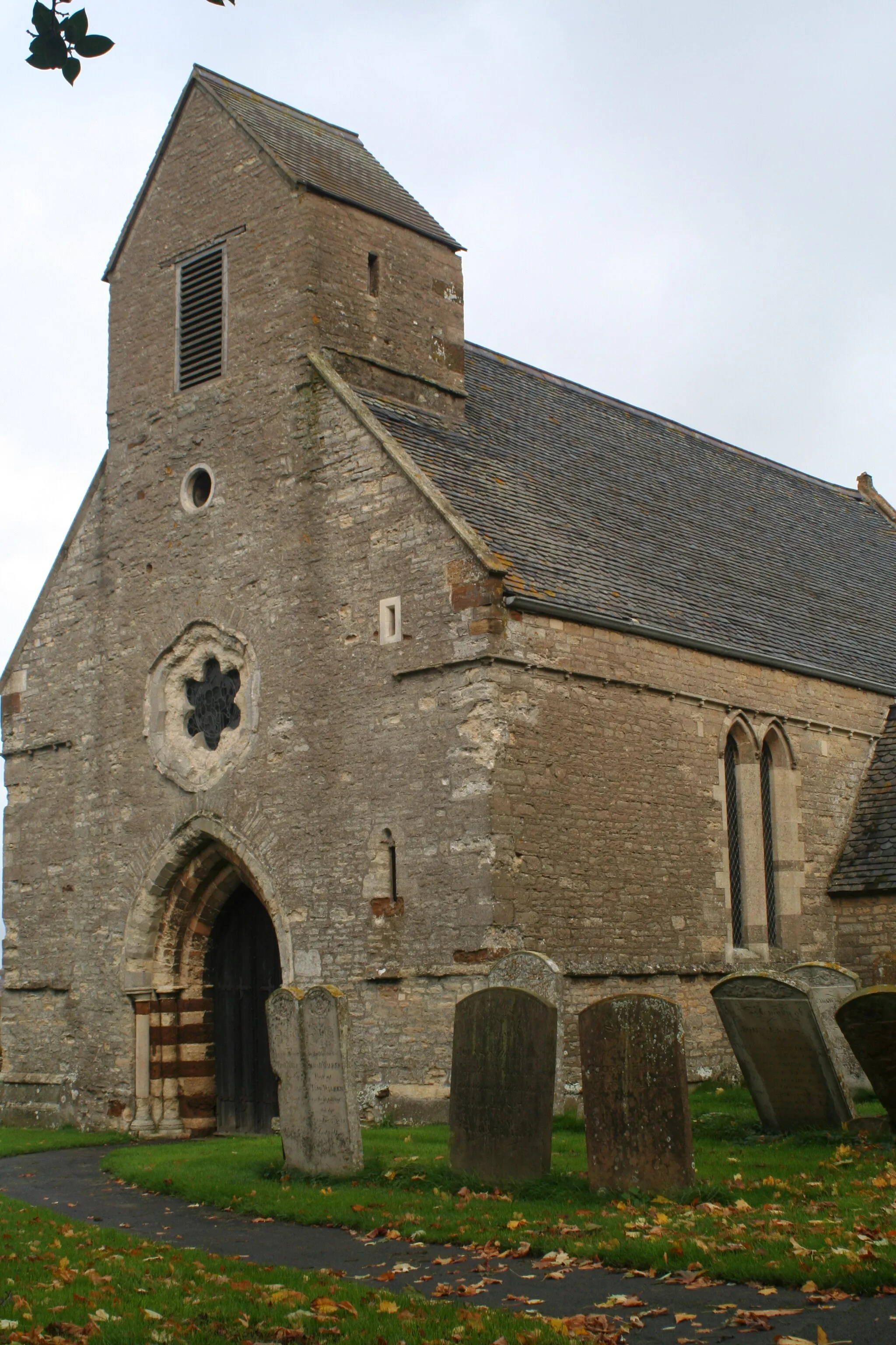 Photo showing: West front of St Romwald's parish church, Strixton, Northamptonshire, seen from the southwest. The west front is 13th-century. The rest of the church was rebuilt in 1873.