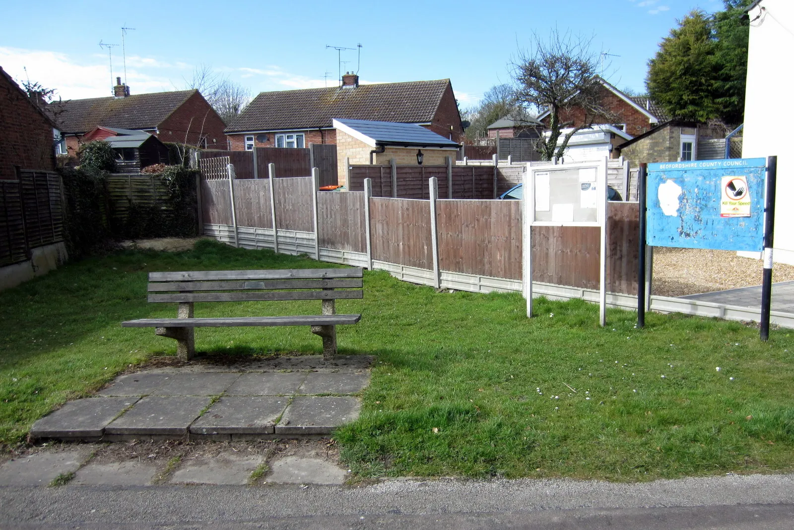 Photo showing: Bench by the village notices