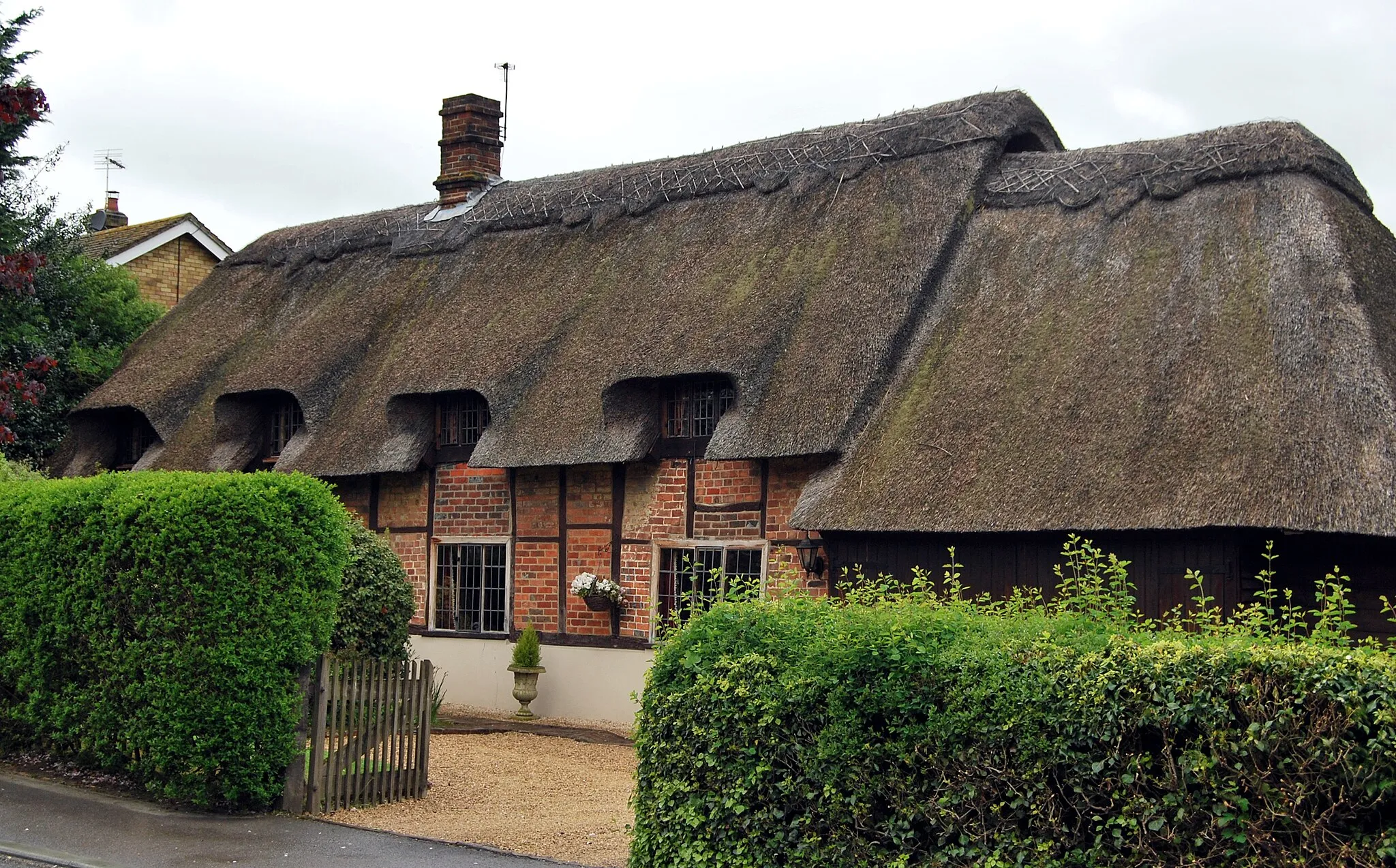Photo showing: Chinnor, Oxfordshire: timber-framed cottage with brick nogging and thatched roof