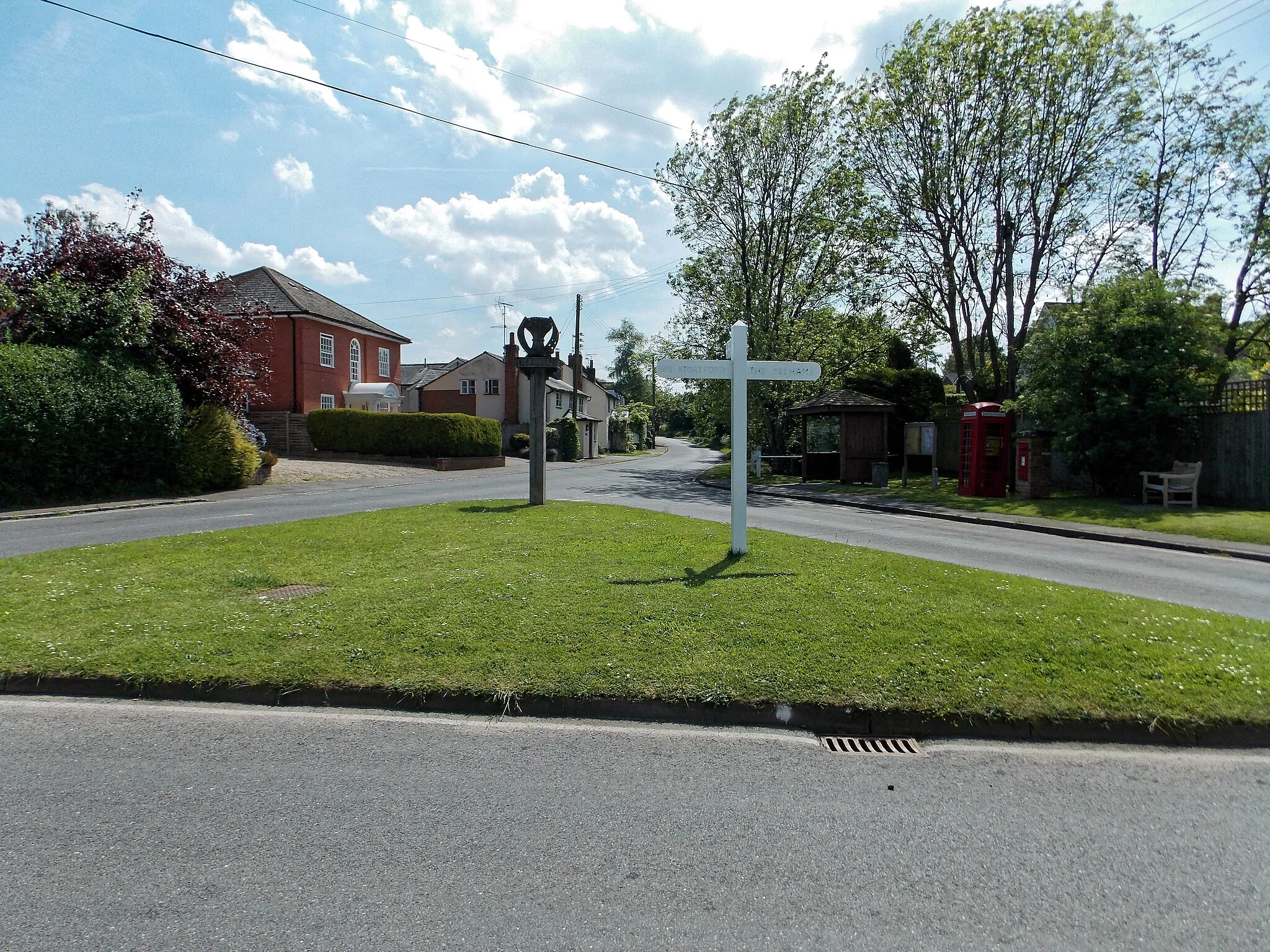 Photo showing: The green triangle road junction of Berden Road and The Street looking south at the centre of the village of Berden, Essex, England. Software: JPEG file optimized and/or cropped and/or spun with DxO OpticsPro 10 Elite and Adobe Photoshop CS2.