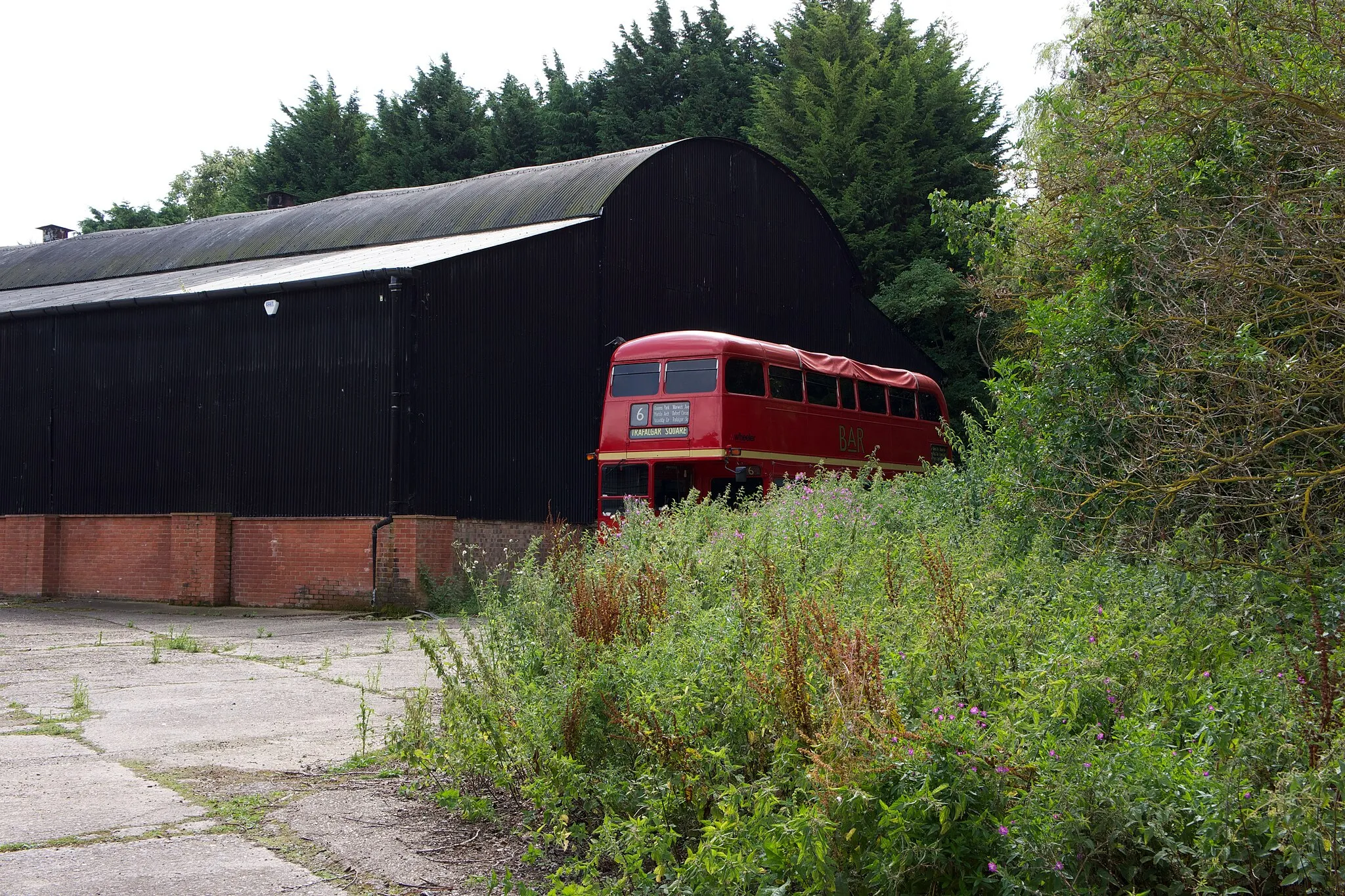 Photo showing: London Bus at Manor Farm Business Park, Higham Gobion. An unexpected sight in the middle of the Bedfordshire countryside, alongside a large shed on the Manor Farm Business Park.