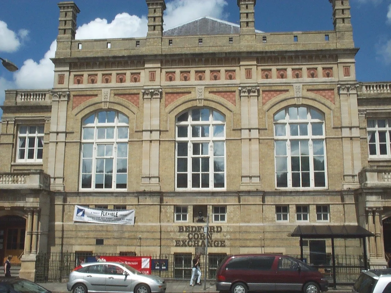 Photo showing: Bedford Corn Exchange, Bedford's Premier venue for music (and some drama).  Glenn Miller played there in World War 2 and there is a little bust of him in an alcove just above the name.  It is also the venue for the Bedford Beer Festival.  It was refurbished a couple of years back to fix the awful acoustics. On the front there is a bust of Glenn Miller and 3 plaques:- File:GlennMillerBustBedford.JPG, File:BedfordCornExchangeGlennMillerPlaque.JPG, File:BedfordCornExchangeLaidPlaque.JPG and File:BedfordCornExchangeOPenPlaque.JPG.