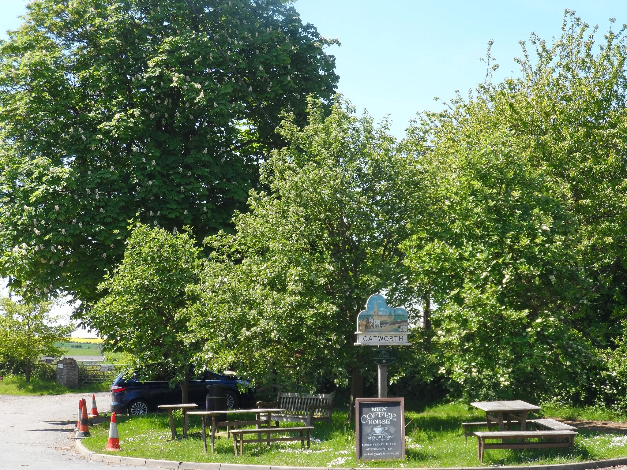 Photo showing: Catworth, seating area opposite Race Horse pub and village sign