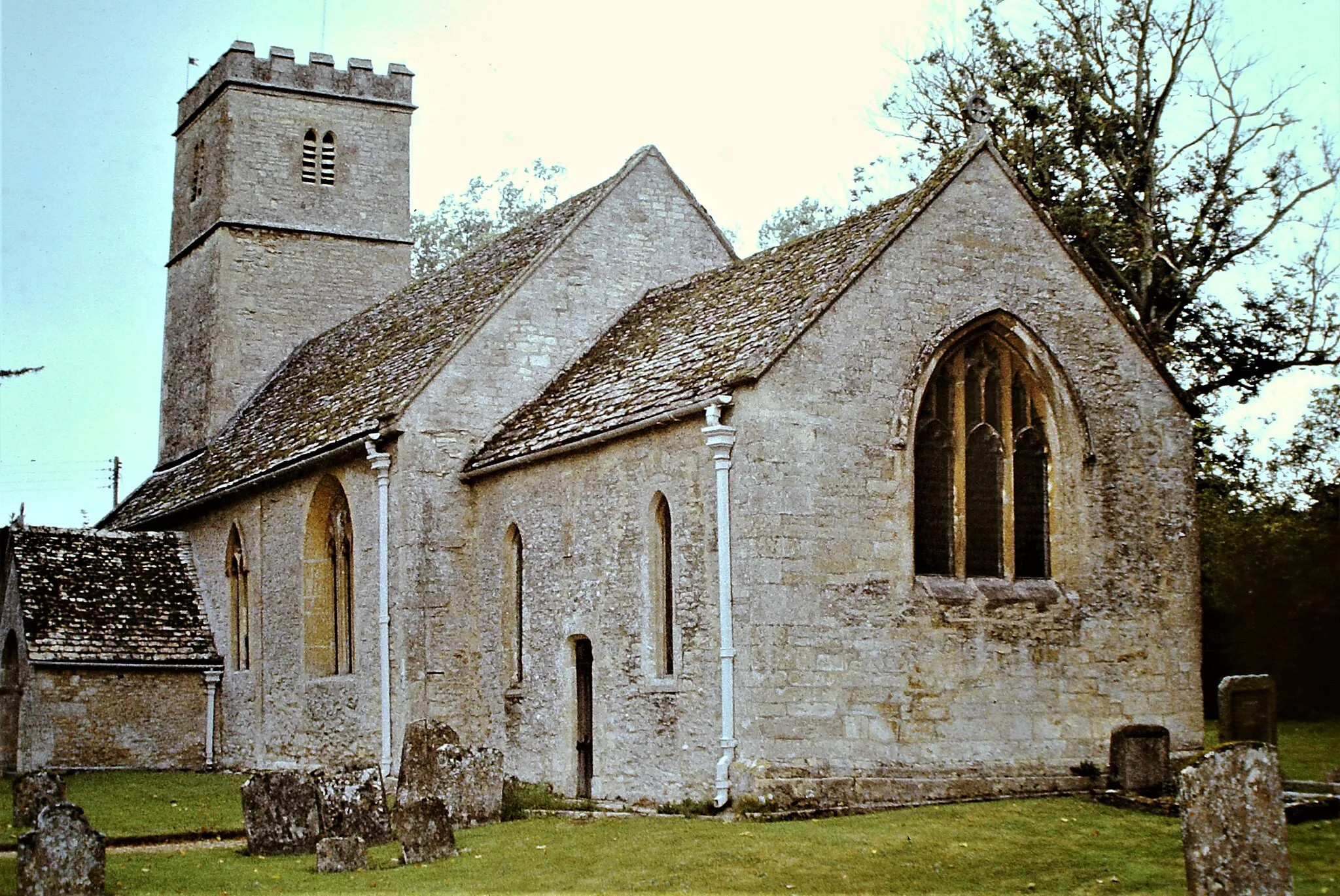 Photo showing: Coln Rogers Church (St. Andrew), Gloucestershire, September 1978. 11th Century Saxon Church, nave and chancel surviving, late 15th / early 16th Century Late Perpendicular tower and porch, and windows inserted into nave and chancel. Scanned slide.