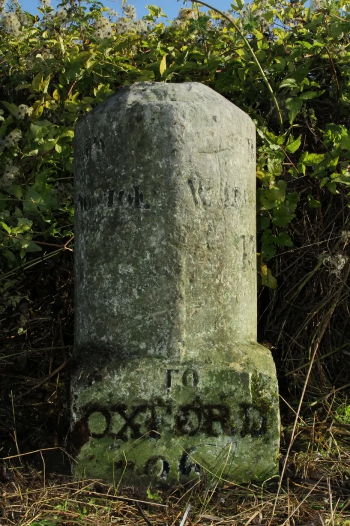 Photo showing: Milestone on the A340 road west of Theale, Berkshire, at the staggered crossroads with the minor road to Bradfield: view from the west