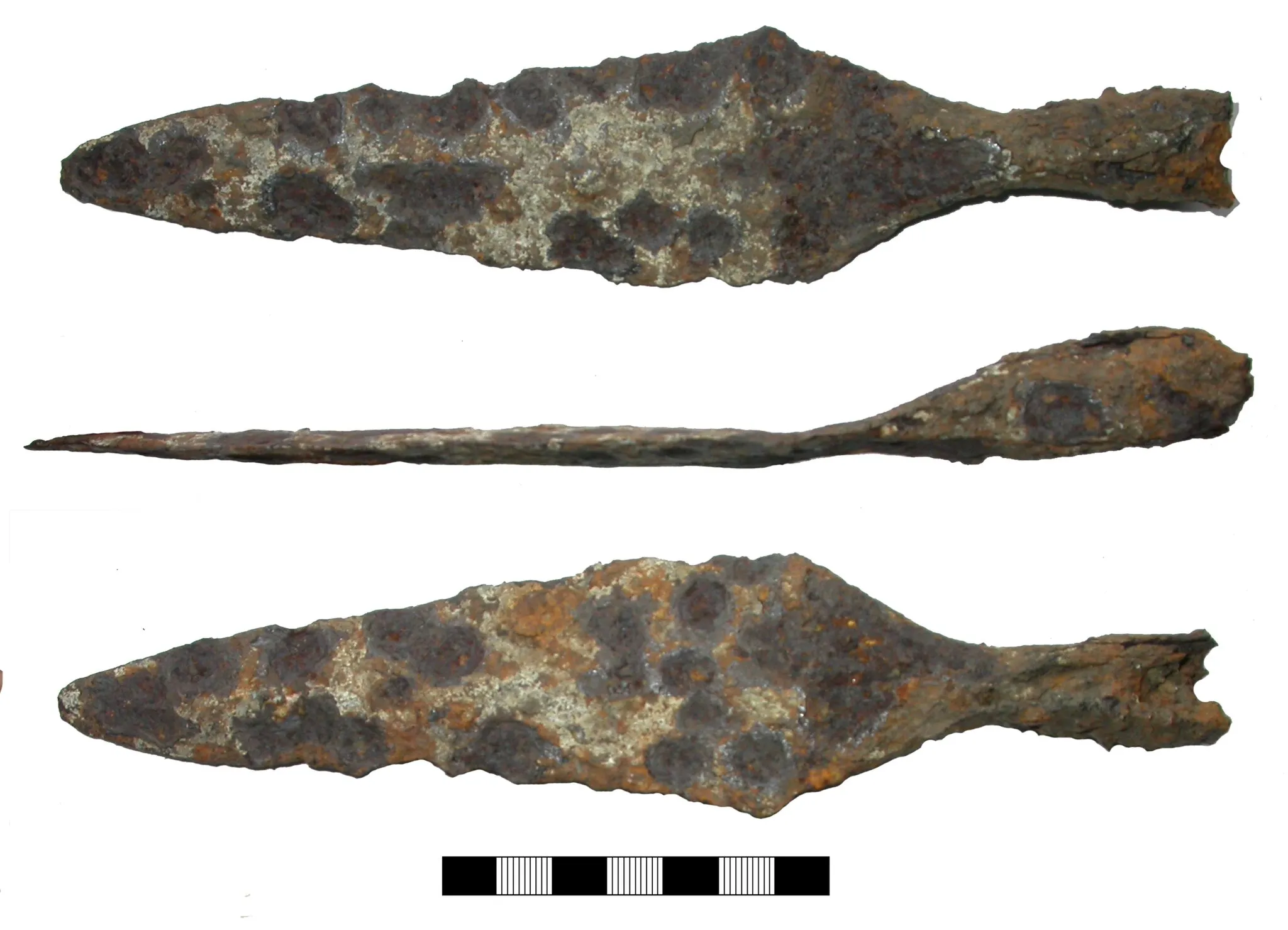 Photo showing: An iron spearhead of Early Anglo-Saxon date. Kevin Leahy comments: "With its open socket and an angled blade which is disproportionally longer than the socket this spear fits into Swanton (1973) Group E1. Swanton feels this Group is early and didn't find any that could be dated as late as the sixth century. I would be more cautious and say fifth-early sixth century."
The spear, which is now in poor condition, measures 210mm long and 46mm wide. In cross section the socket has two almost straight sides, the others being rounded. The spear is bent slightly form the base of the blade. The internal length of the socket is 19.28mm.