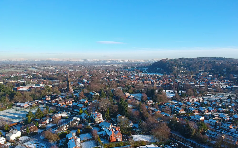 Photo showing: Aerial photograph of Alderley Edge taken in December 2017, showing St. Philips Church (centre left) and the Edge sandstone escarpment (right).