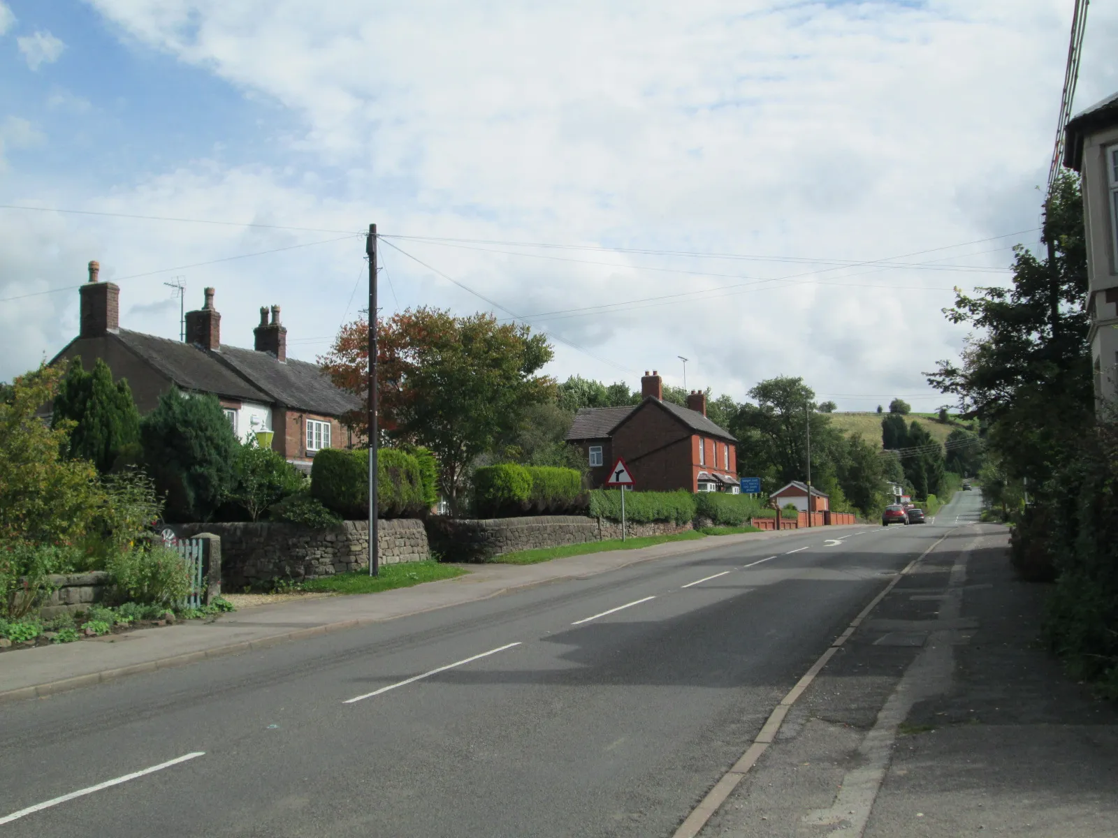 Photo showing: Looking south along the main road (the A523) through the village.