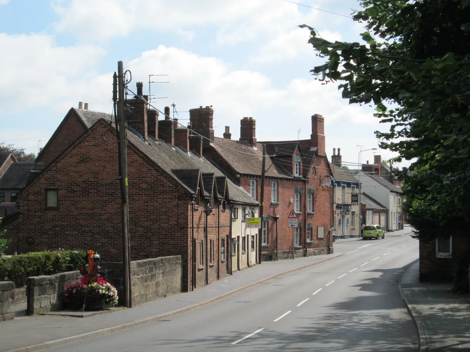 Photo showing: Looking east towards the White Hart pub, from near the bridge over the river Tean.