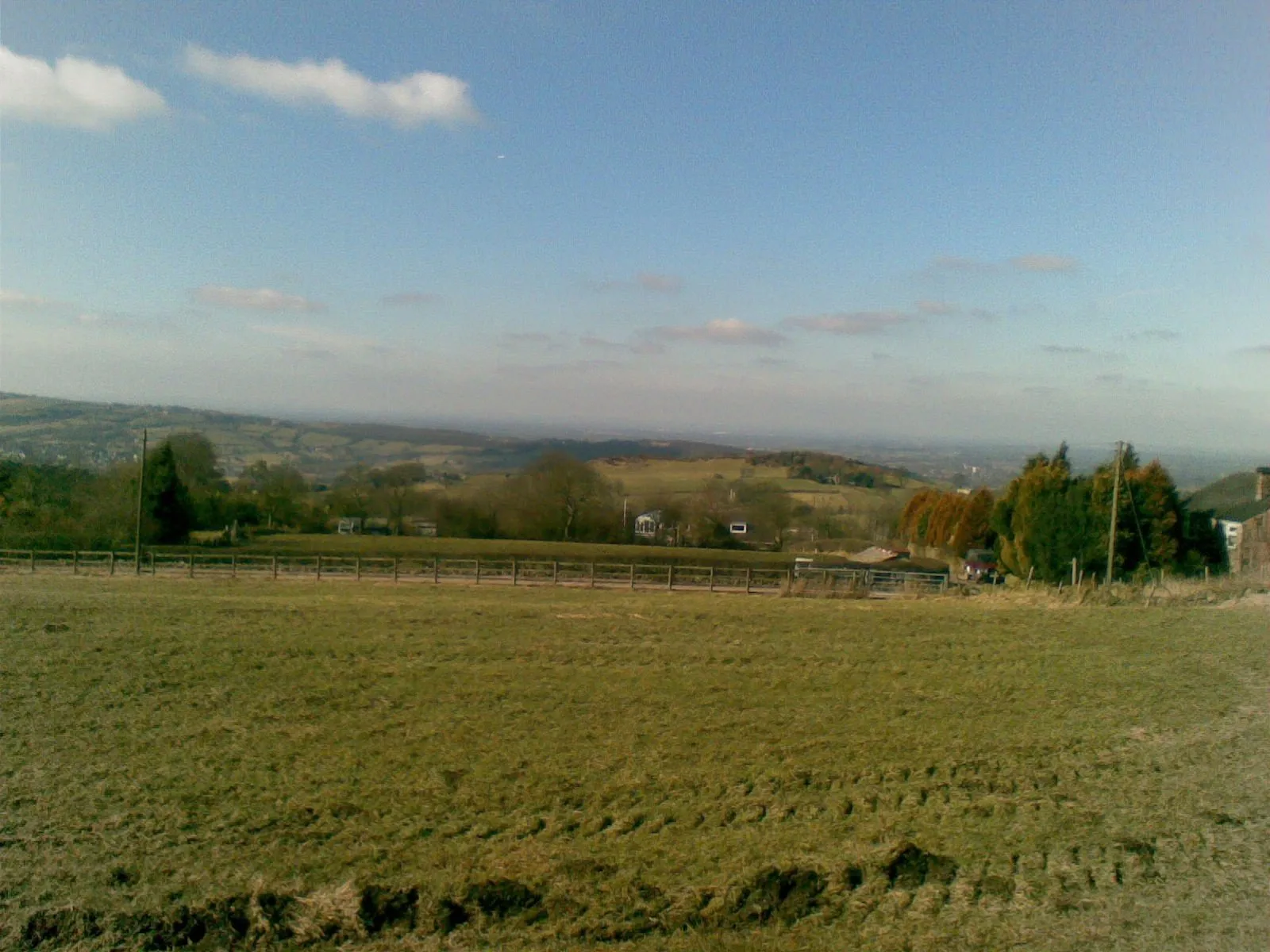 Photo showing: Biddulph in spring sunlight From the minor road adjacent to trig point 336, Biddulph is left middle distance, small caravan park/storage in centre, looking to the right of Mow Cop (not in picture) across to where the hills of North Wales are visible on a really clear today, but not today!