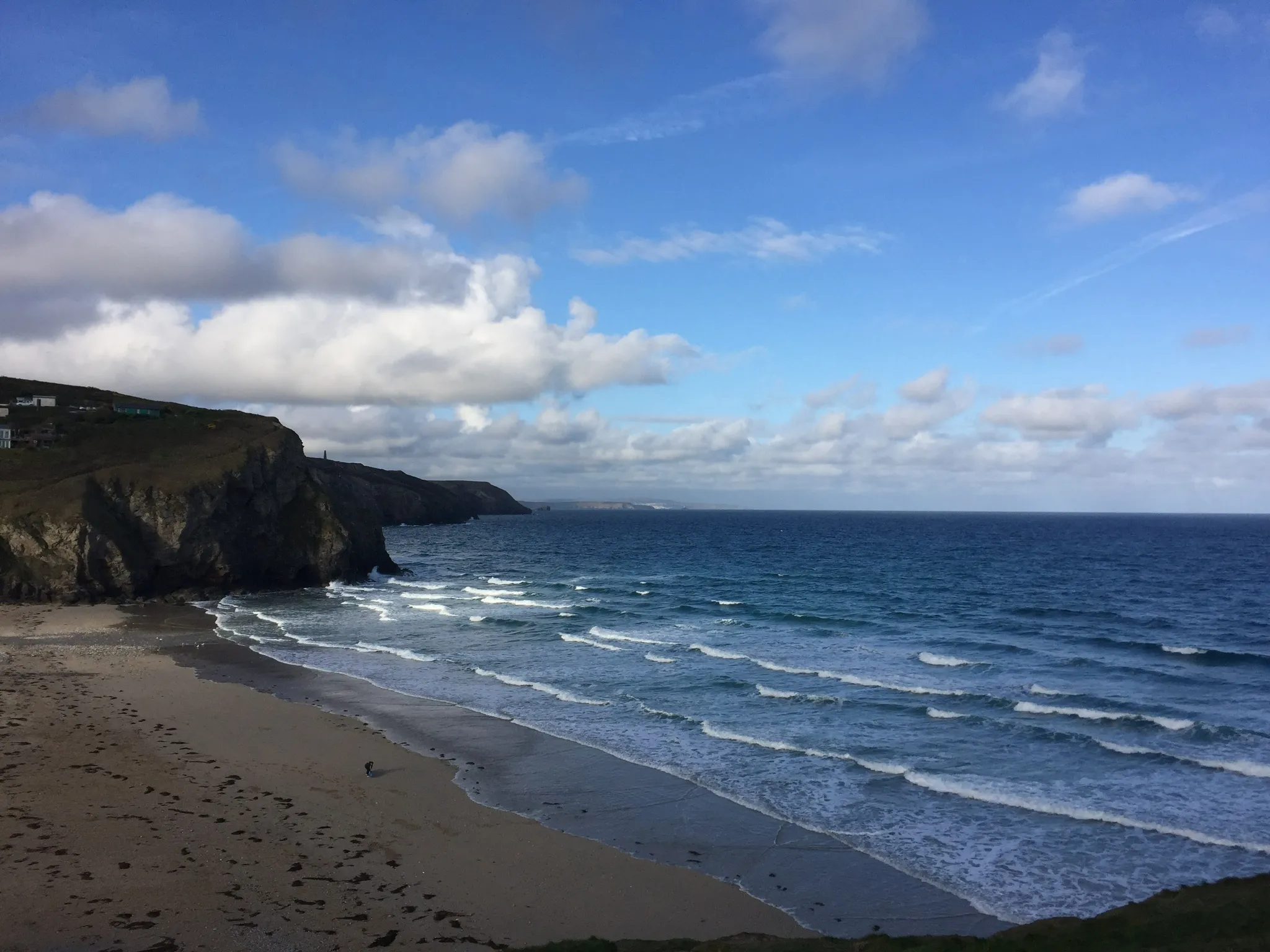 Photo showing: View over Porthtowan from the East Cliff. Clear day can see St Ives in the distance