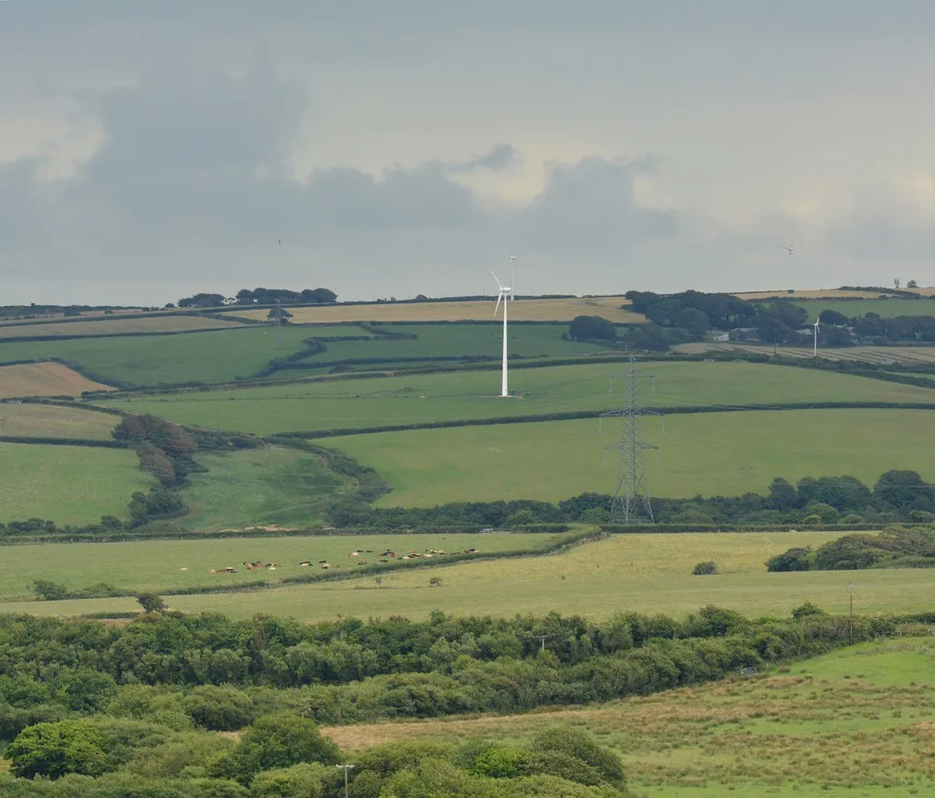 Photo showing: Farmland, turbines and a pylon, near Tresparrett, Cornwall