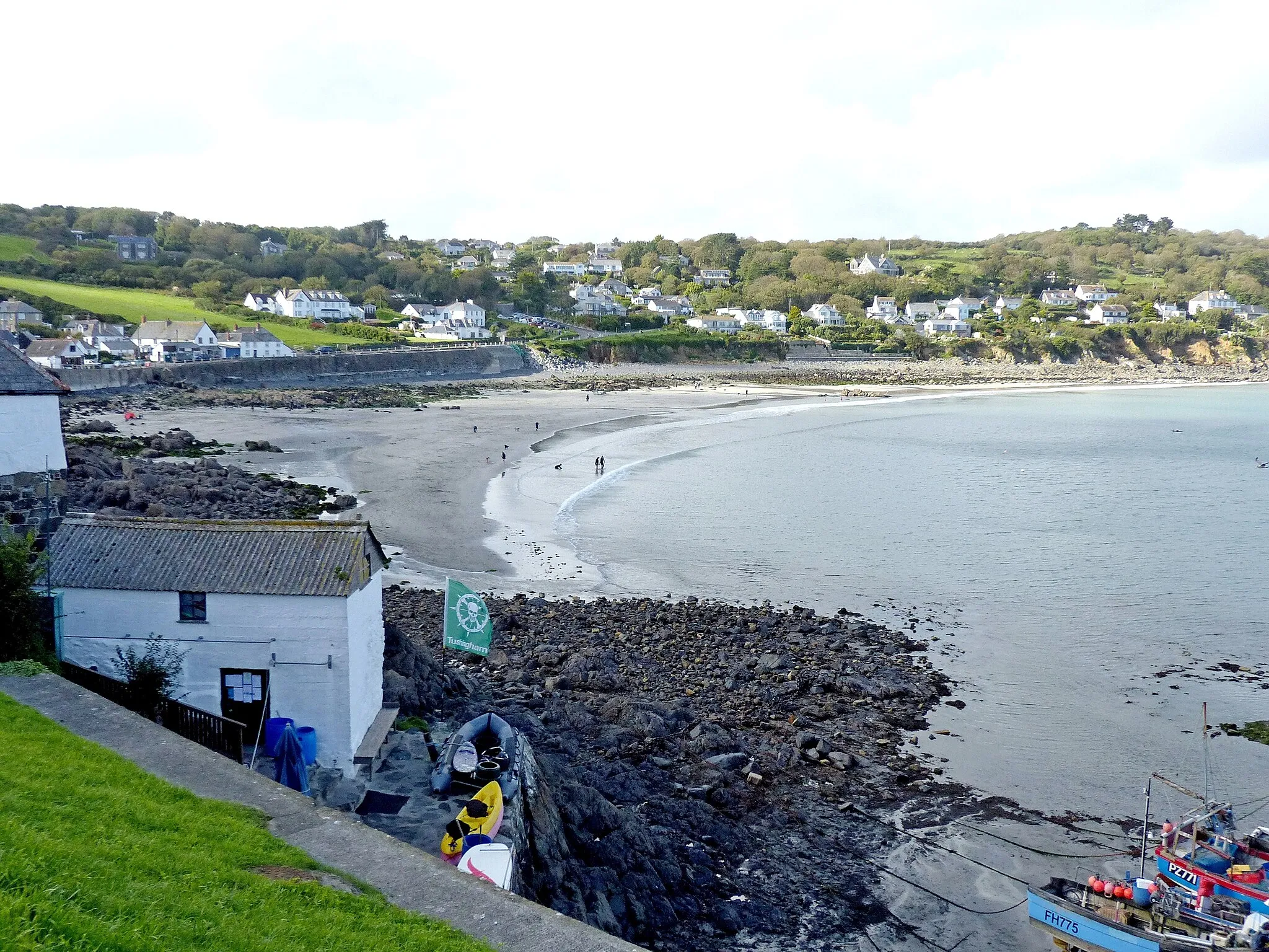 Photo showing: Coverack, Cornwall, England, from above the harbour. The collapse of the sea wall at picture centre (below the parked cars) happened during the 18th July 2017 flood (seven weeks before I took this picture).