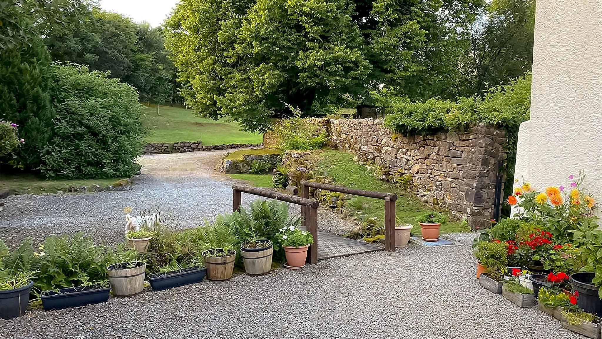 Photo showing: Rowrah Hall Driveway in front of The Old Hayloft, showing Bridge over Stream and Garden Walls