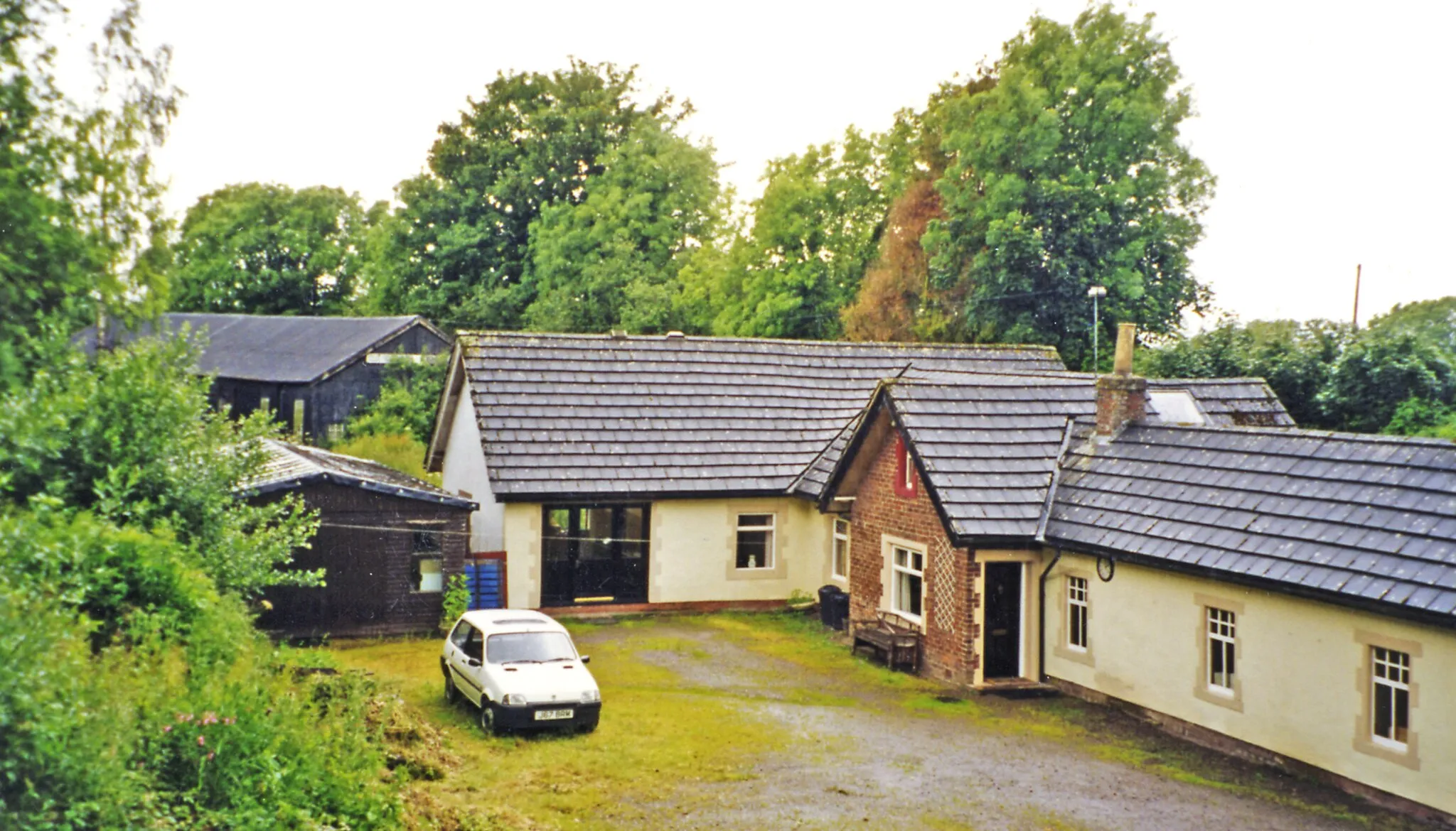 Photo showing: Former Kirkandrews station, 2002.
View NW, towards Silloth: ex-NBR Carlisle - Silloth line, all closed from 7/9/64. The station has been well-converted and extended after private acquisition.