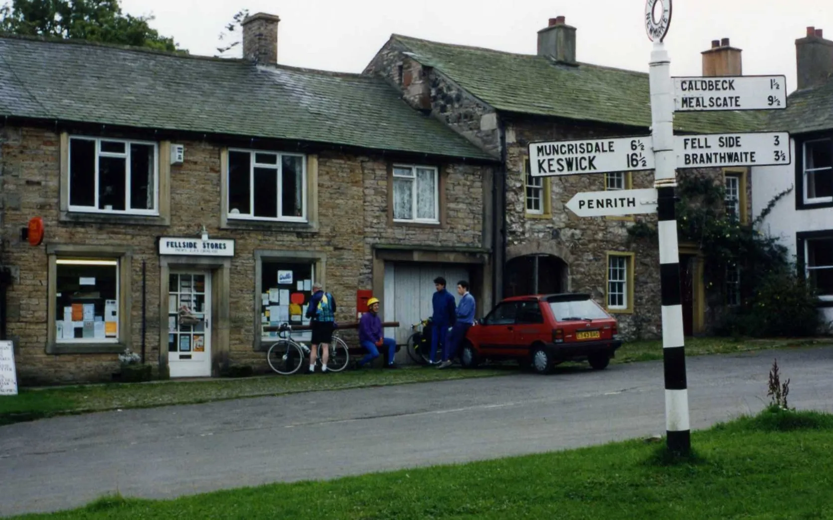 Photo showing: Hesket Newmarket Post Office with fingerpost, Sept 1994
