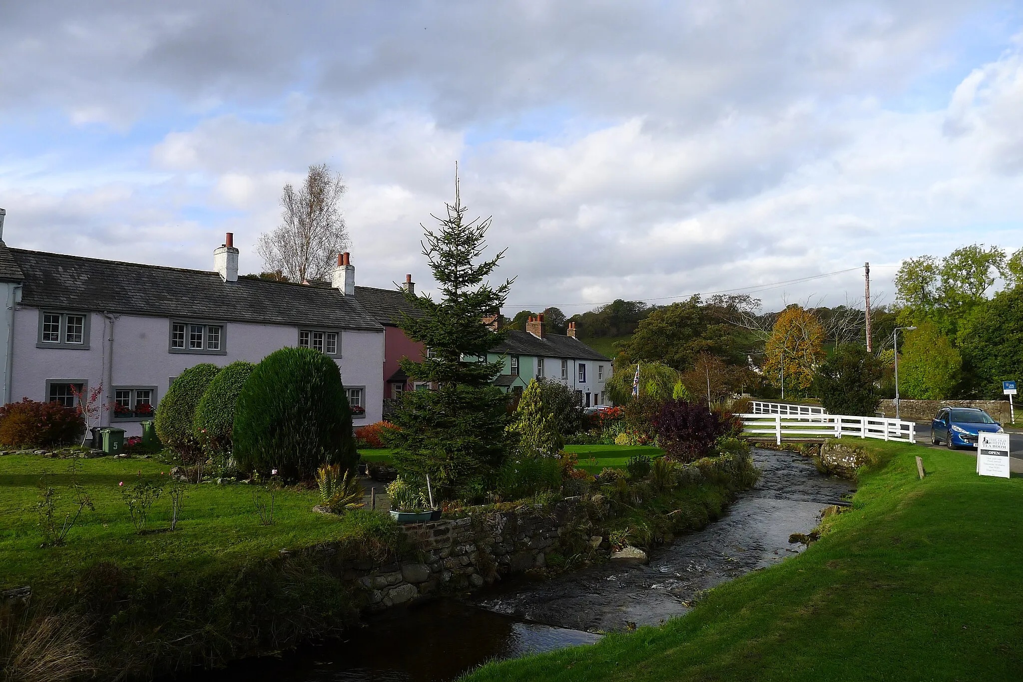 Photo showing: Colourful houses next to Gill Beck, Caldbeck