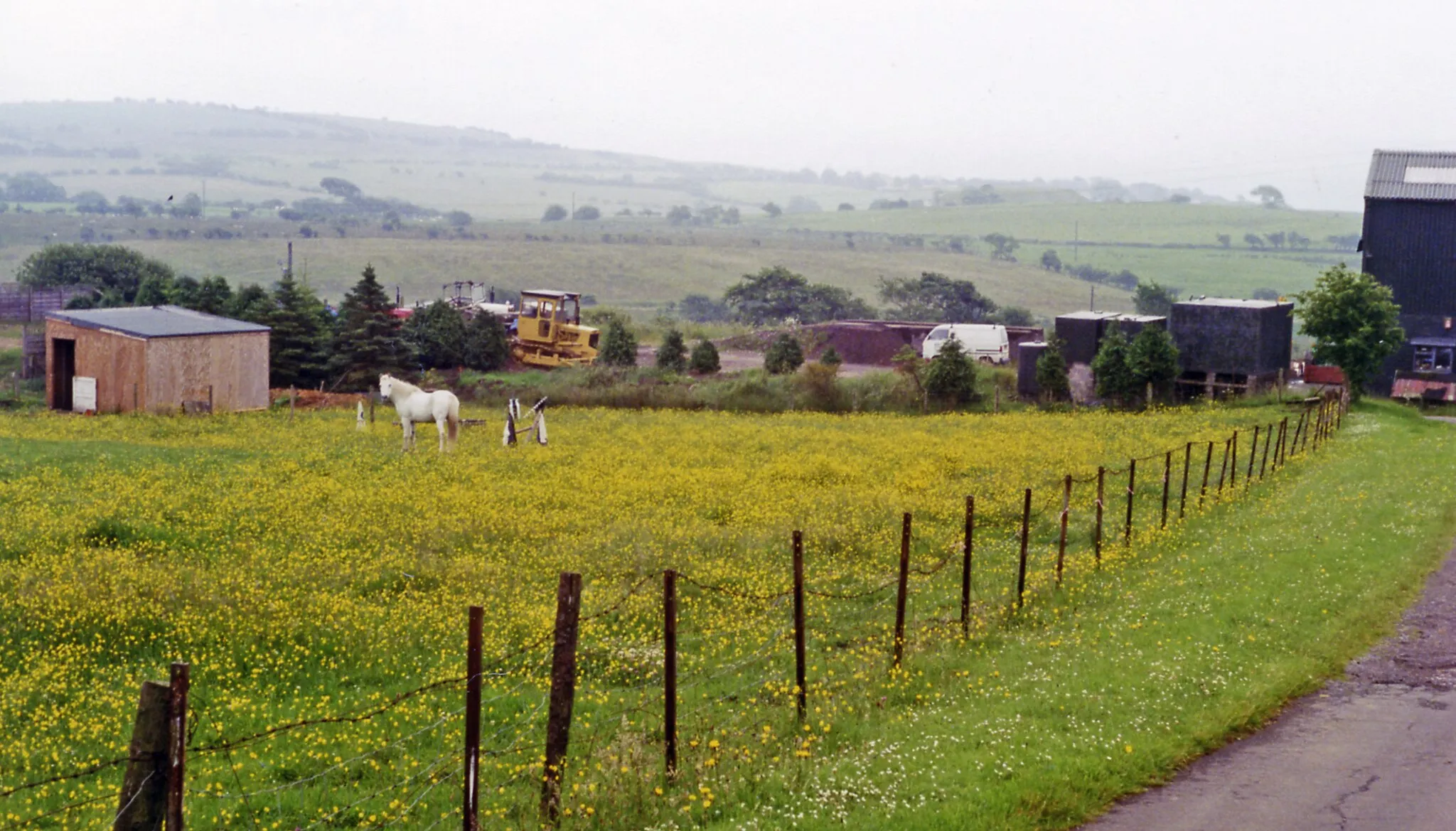 Photo showing: Site of Arlecdon station.
View north to the Fells near Lamplugh. Until closed finally from 7/8/38 - to passengers on 1/1/27, the branch from Distington (to the left) of the former Cleator & Workington Junction Railway had run to Rowrah (to the right). The Pullman car now used at the Hound Inn, Arlecdon as a restaurant must have been brought by road!