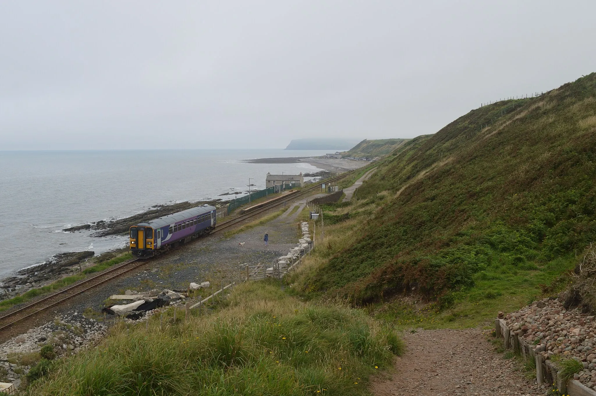 Photo showing: A somewhat overcast afternoon on the scenic Cumbrian Coast route sees Northern owned 153.359 on 2C46, 12.08 Carlisle to Barrow-in-Furness. Date taken = 18 July 2016.