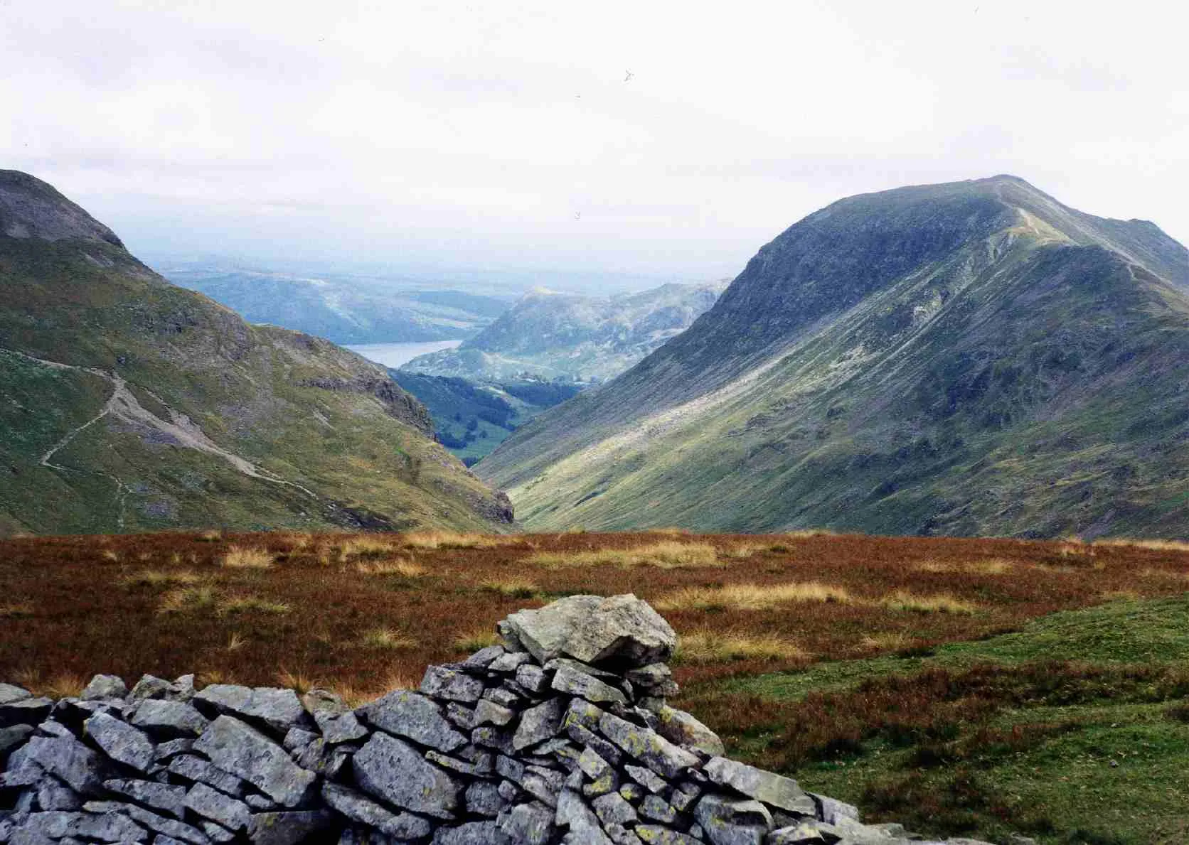 Photo showing: Looking down Grisedale to Ullswater in the far distance from Seat Sandal summit, St Sunday Crag is the fell on the right.
Personal picture taken by Mick Knapton