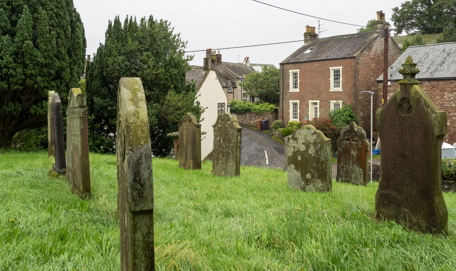 Photo showing: Gravestones at St. John's Church, Beckermet
