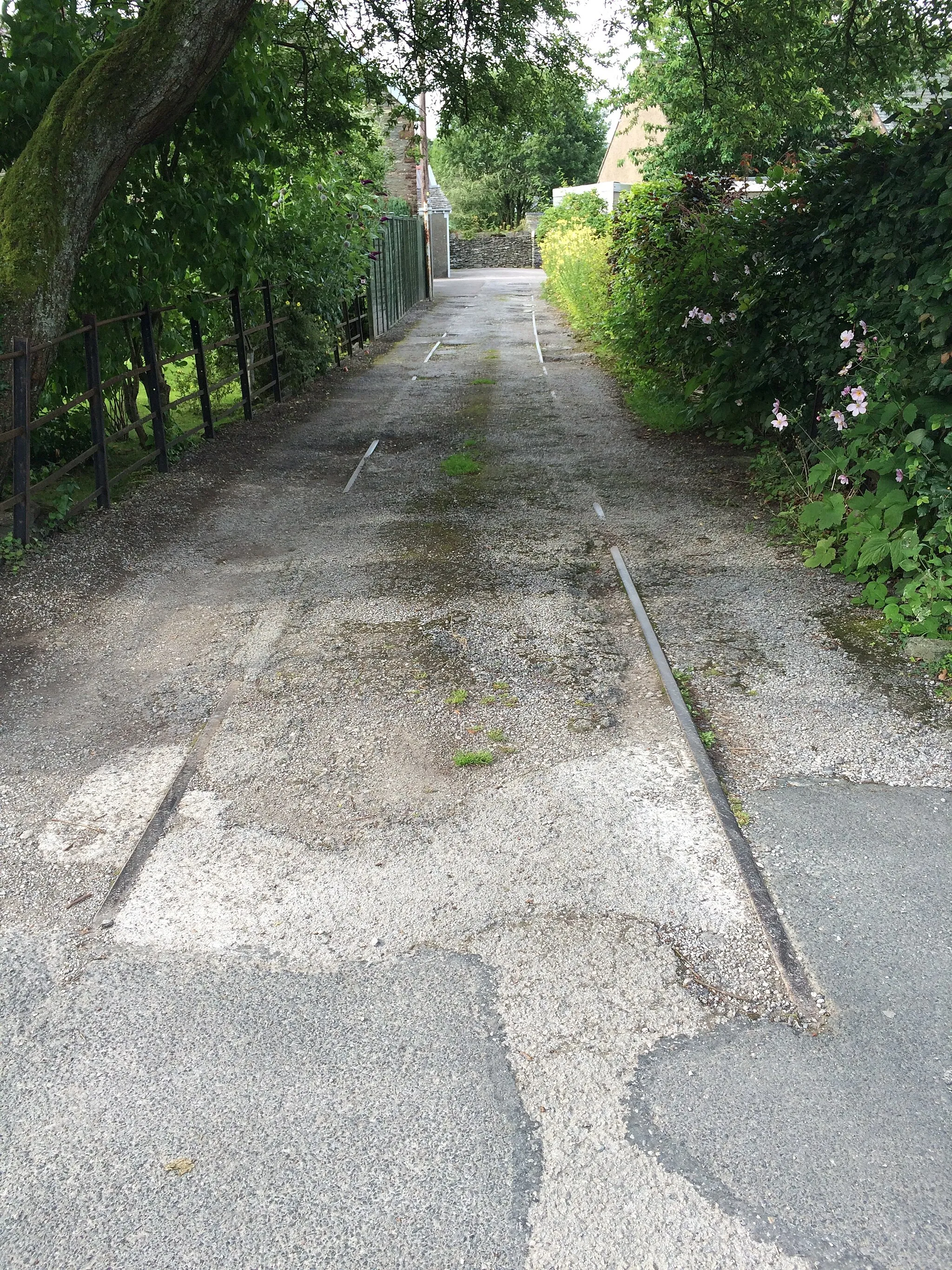 Photo showing: Railway track in a private driveway, Burneside, Cumbria. The track remains from the former railway good yard.