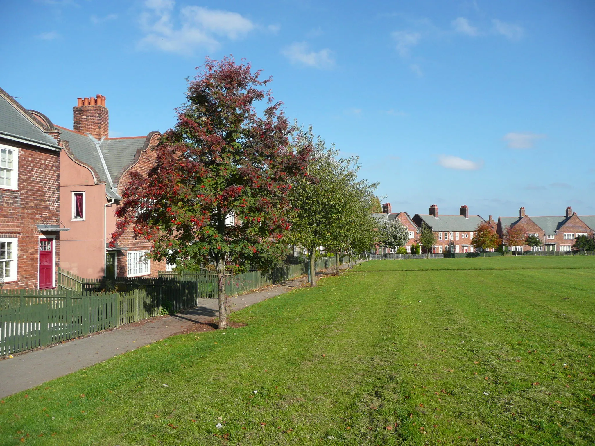 Photo showing: Trees on the edge of the green, Creswell Model Village