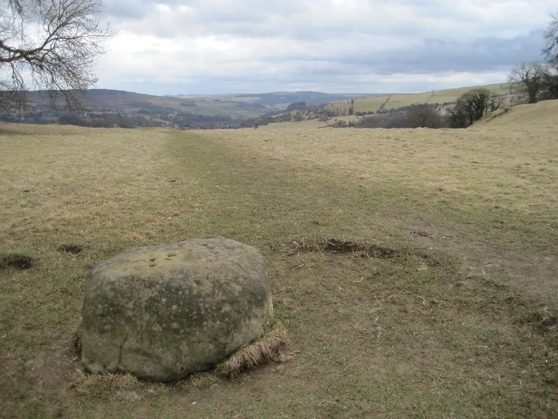 Photo showing: The Boundary Stone, Eyam, Derbyshire, with holes believed to be where coins were place for trade during the quarantine of the Bubonic Plague outbreak of 1665-6.