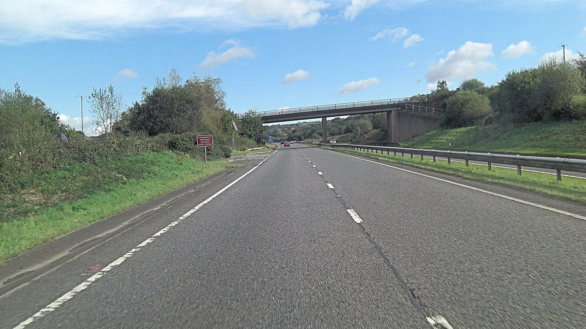 Photo showing: A30 unnamed lane crosses from Rivermead