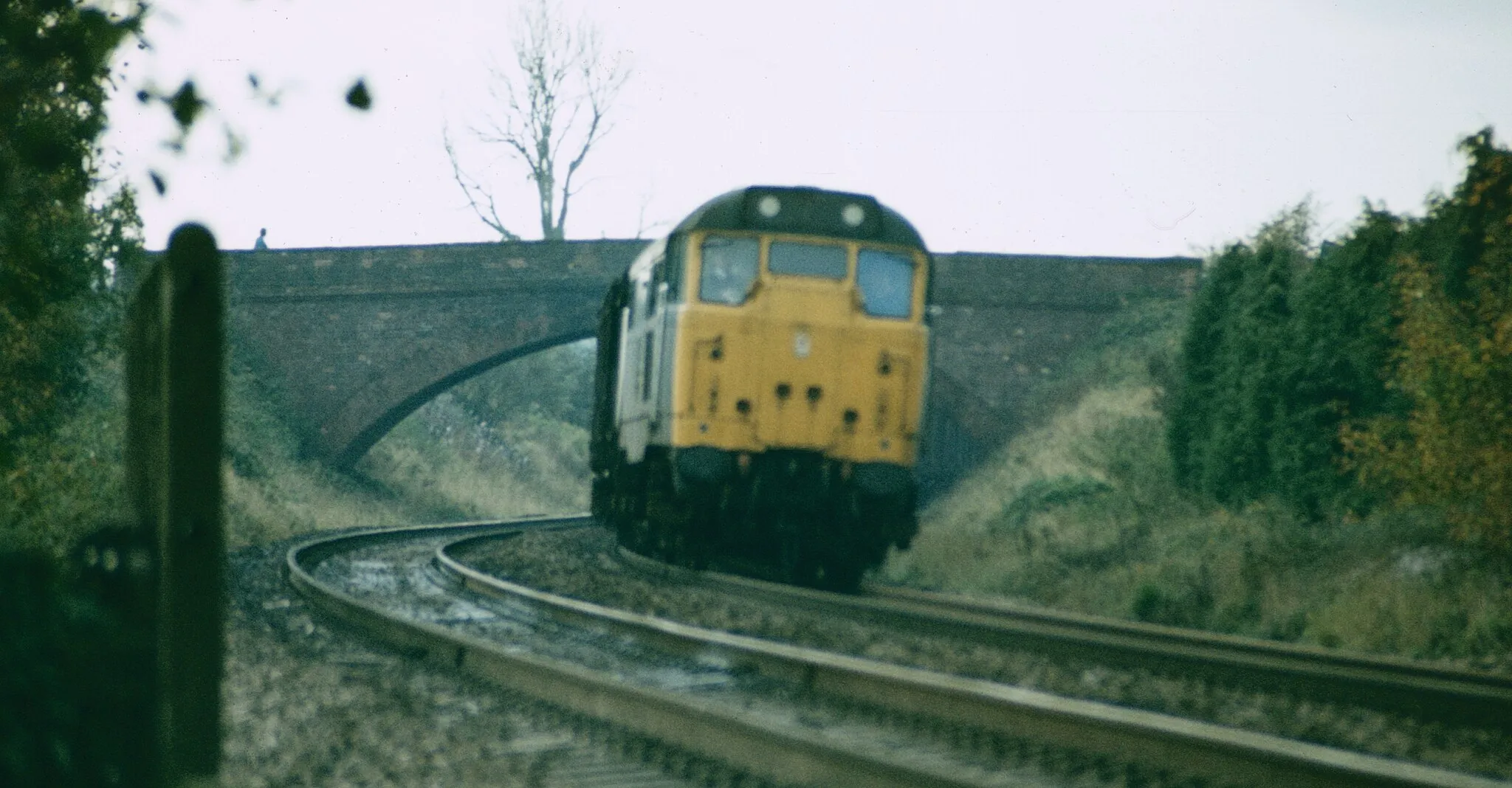 Photo showing: An unidentified Class 31 leans to the curve as it heads downhill past Rockwell Green at Wellington, on the descent from Whiteball to Taunton.