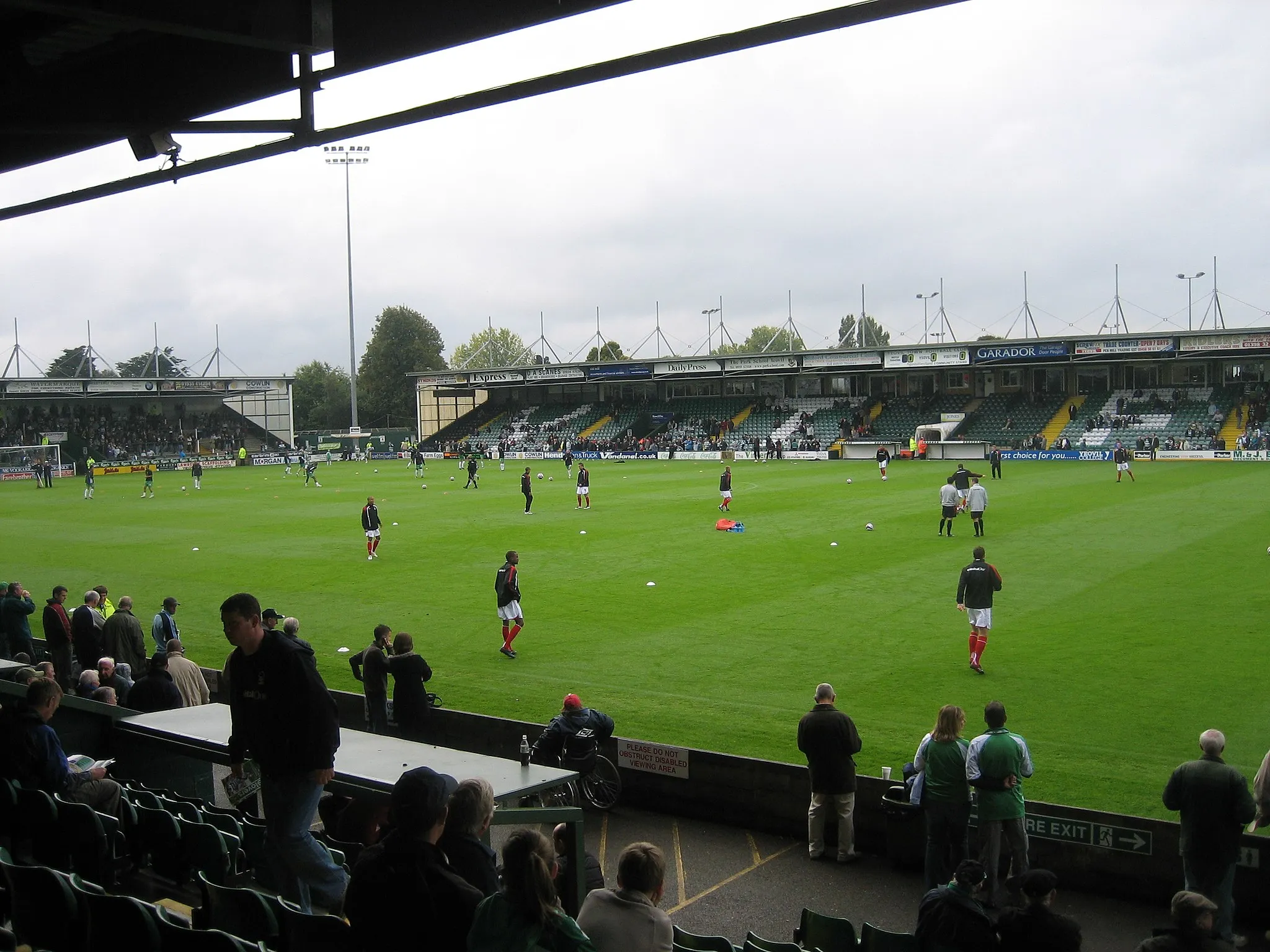 Photo showing: Huish Park, 29 September 2007, Yeovil Town and Nottingham Forest players warm up on the pitch before the match, which Forest won 3-0