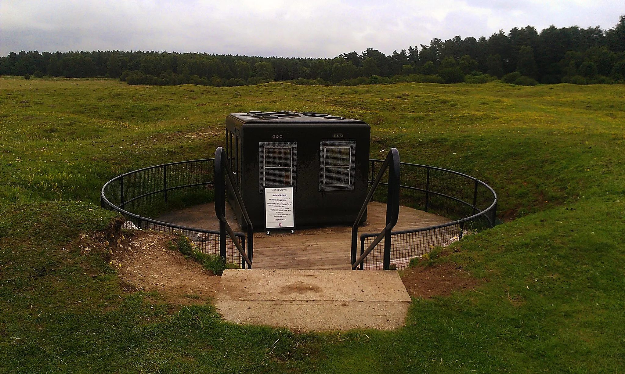 Photo showing: The entrance to the publicly-accessible pit at Grimes Graves, Norfolk. 2012.