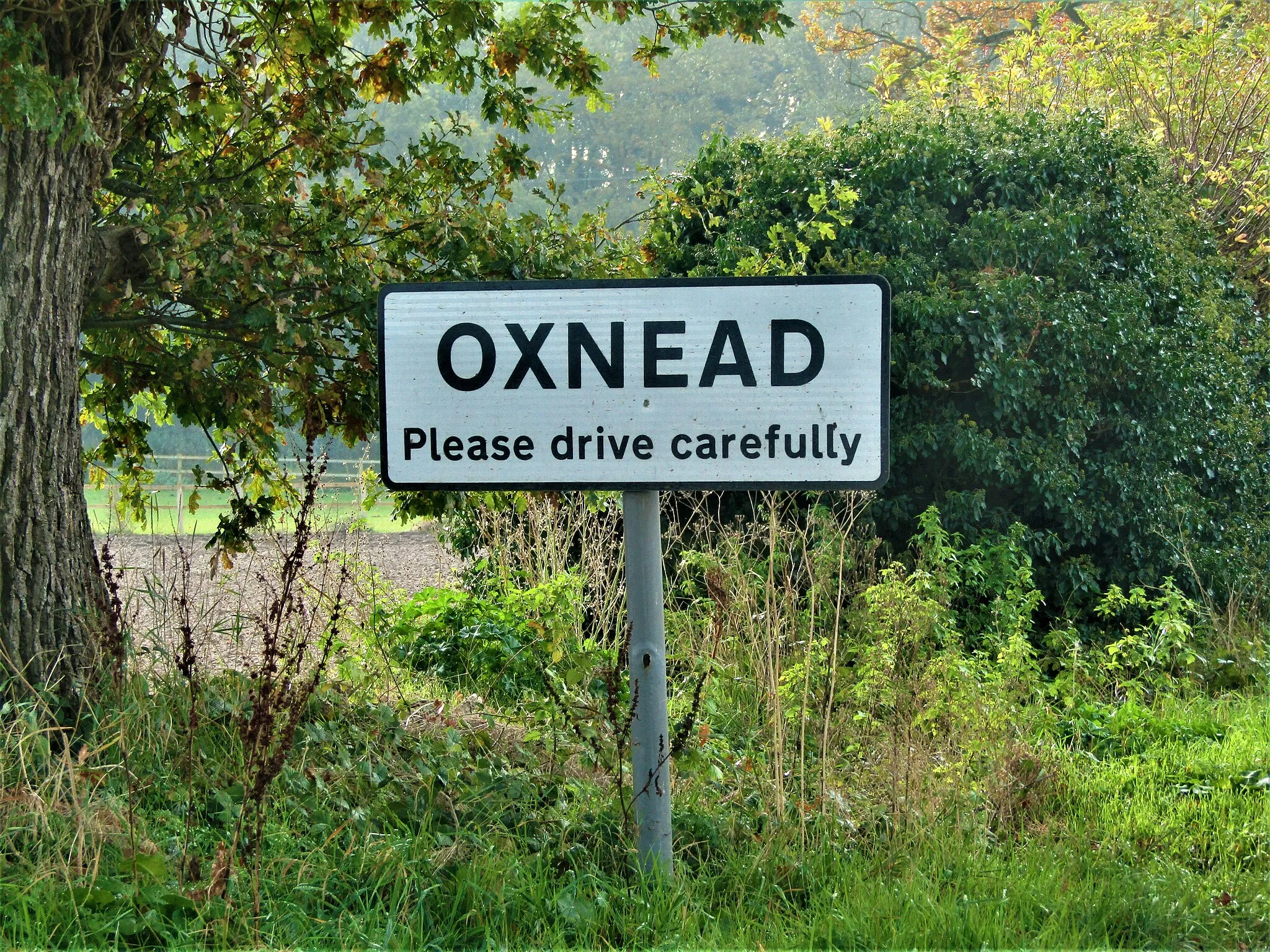 Photo showing: The place name sign located on Church Road in the hamlet of Oxnead, Norfolk, England.