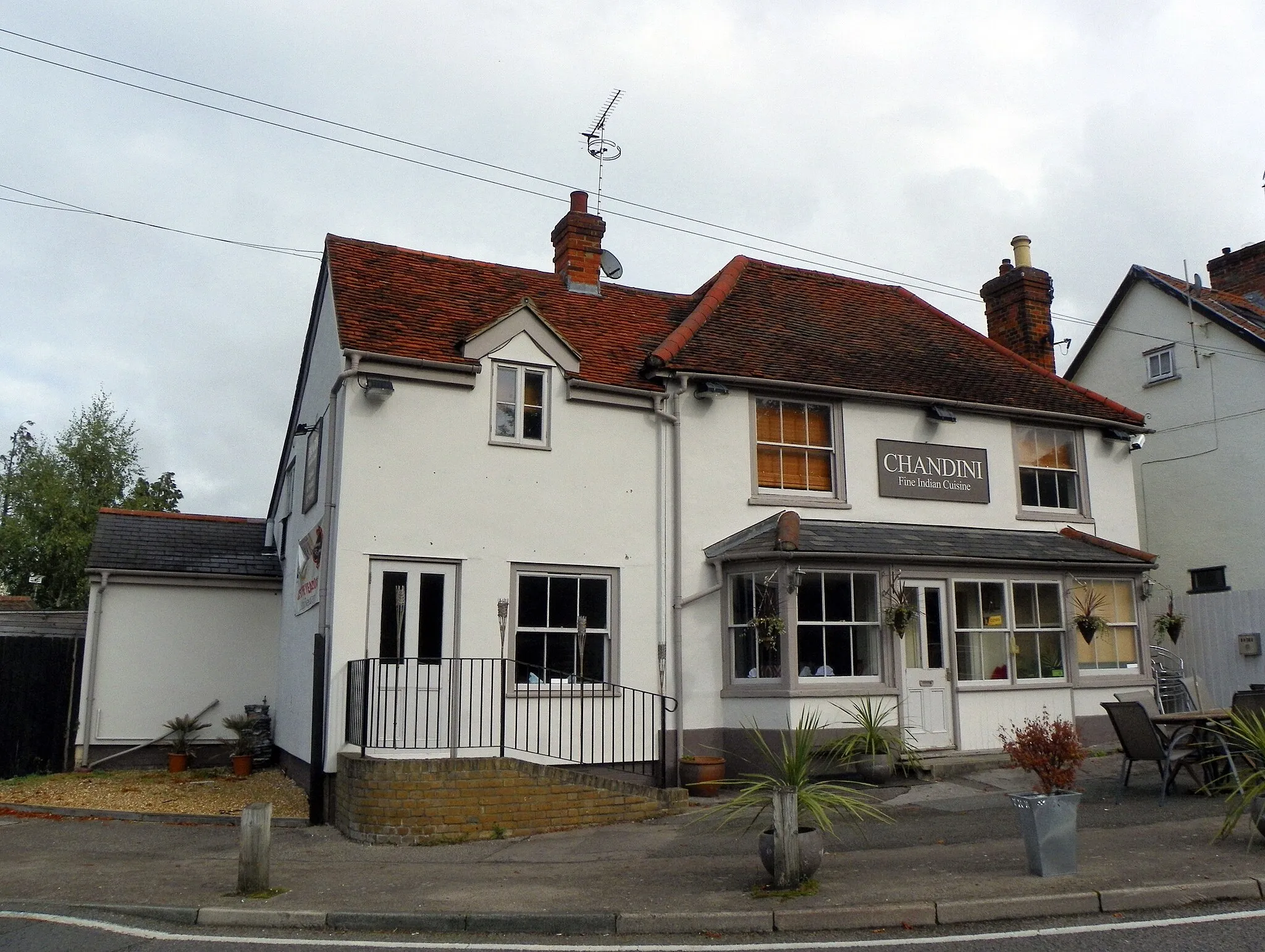 Photo showing: Chandini Indian restaurant, High Wych, Hertfordshire, formerly the Half Moon Public House (Grade II), built in 17th century or earlier, remodelled in the 18th century, and obviously refurbished more recently. On Google Street View, it says "opening soon", and the house is a different colour.

GOC Hertfordshire's walk on 8 October 2016, a 9.6-mile figure-of-eight walk in and around Sawbridgeworth and High Wych in Hertfordshire, and Little Hallingbury and Lower Sheering in Essex. Martin T led the walk, which was attended by 13 people in total. You can view my other photos of this event, read the original event report, find out more about the Gay Outdoor Club or see my collections.