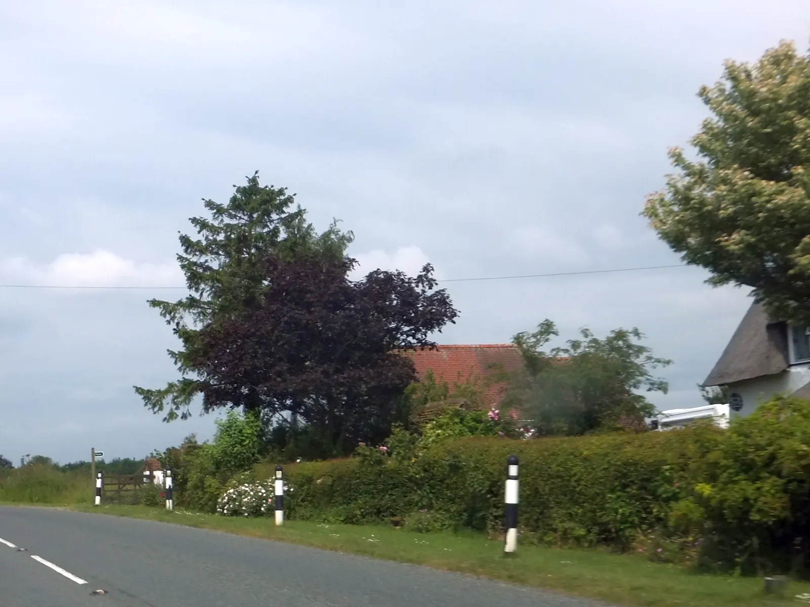 Photo showing: B1078 passing Tudor Cottage and footpath sign