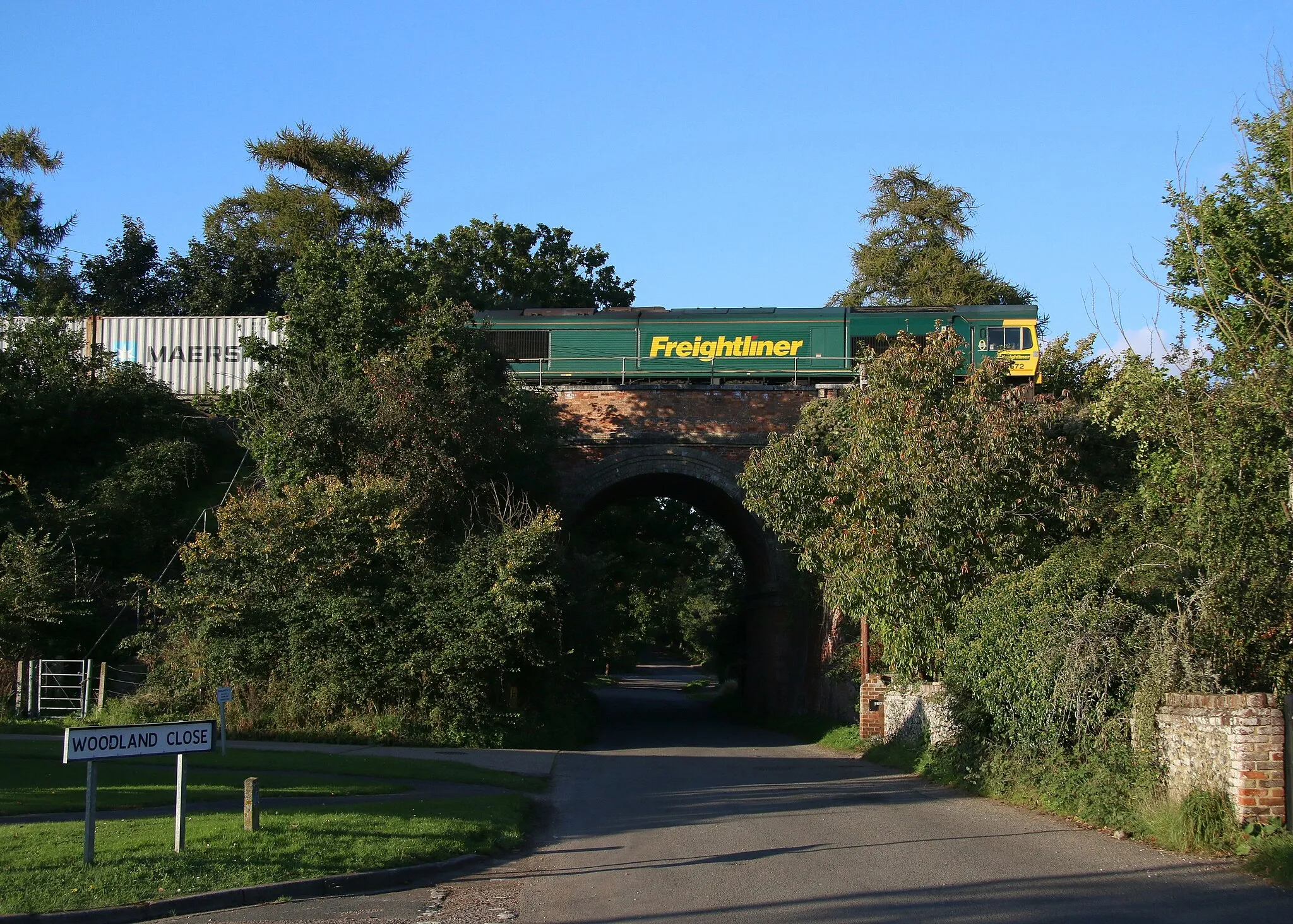 Photo showing: In late Autumn afternoon sun 66 572 leads a Leeds to Felixstowe Freightliner service through Thurston, near Bury St Edmunds