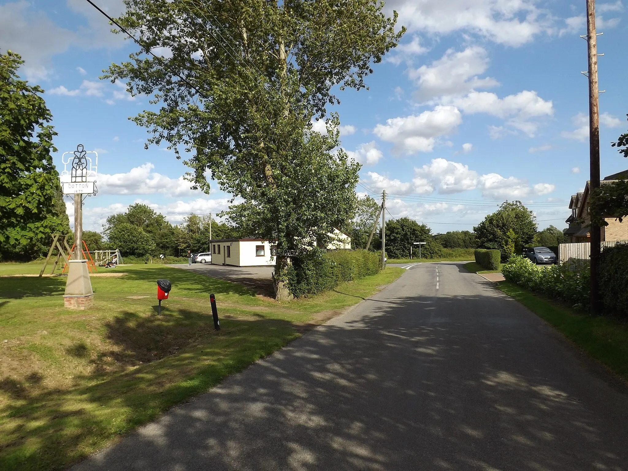 Photo showing: Blacksmith Road & Cotton Village sign
