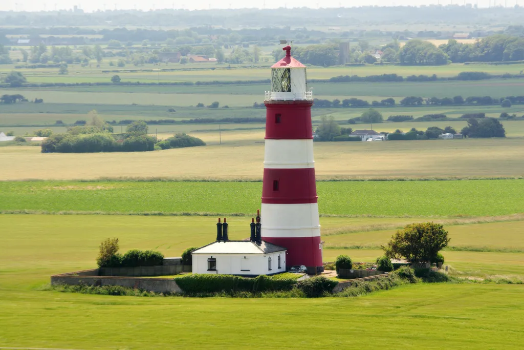 Photo showing: Happisburgh lighthouse, Happisburgh, Norfolk, UK. Photographed from the top of St Mary's Church tower