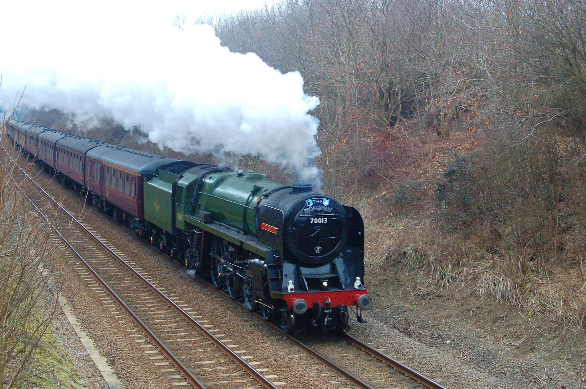 Photo showing: Preserved British Railways Standard Class 7MT locomotive number 70013 'Oliver Cromwell' approaching passing Hethersett on the outskirts of Norwich with a special train heading for the North Norfolk Railway on 11 March 2010 to celebrate re-connection of the NNR to the national railway network.