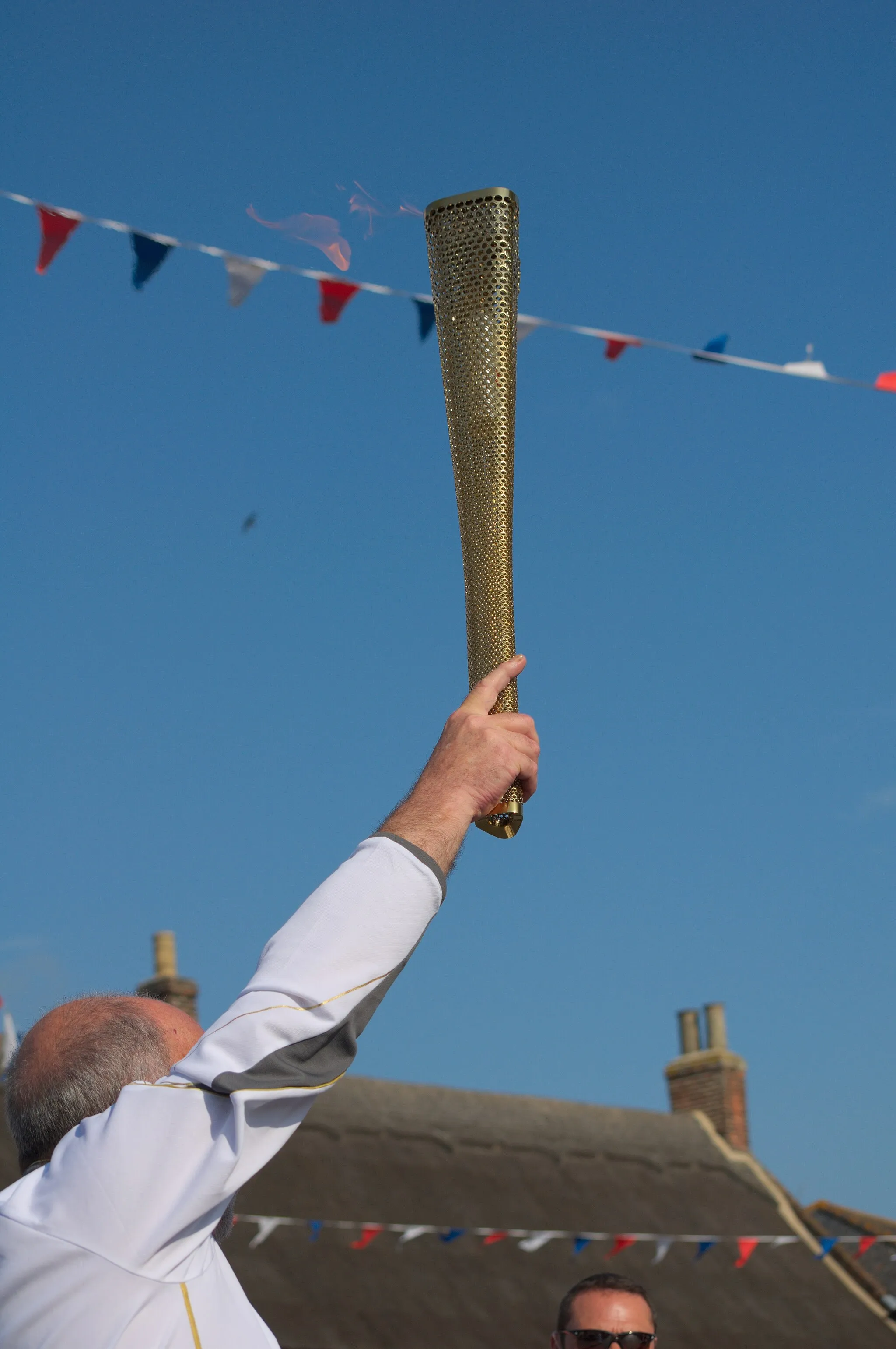 Photo showing: The torch during the pass through Acle.
