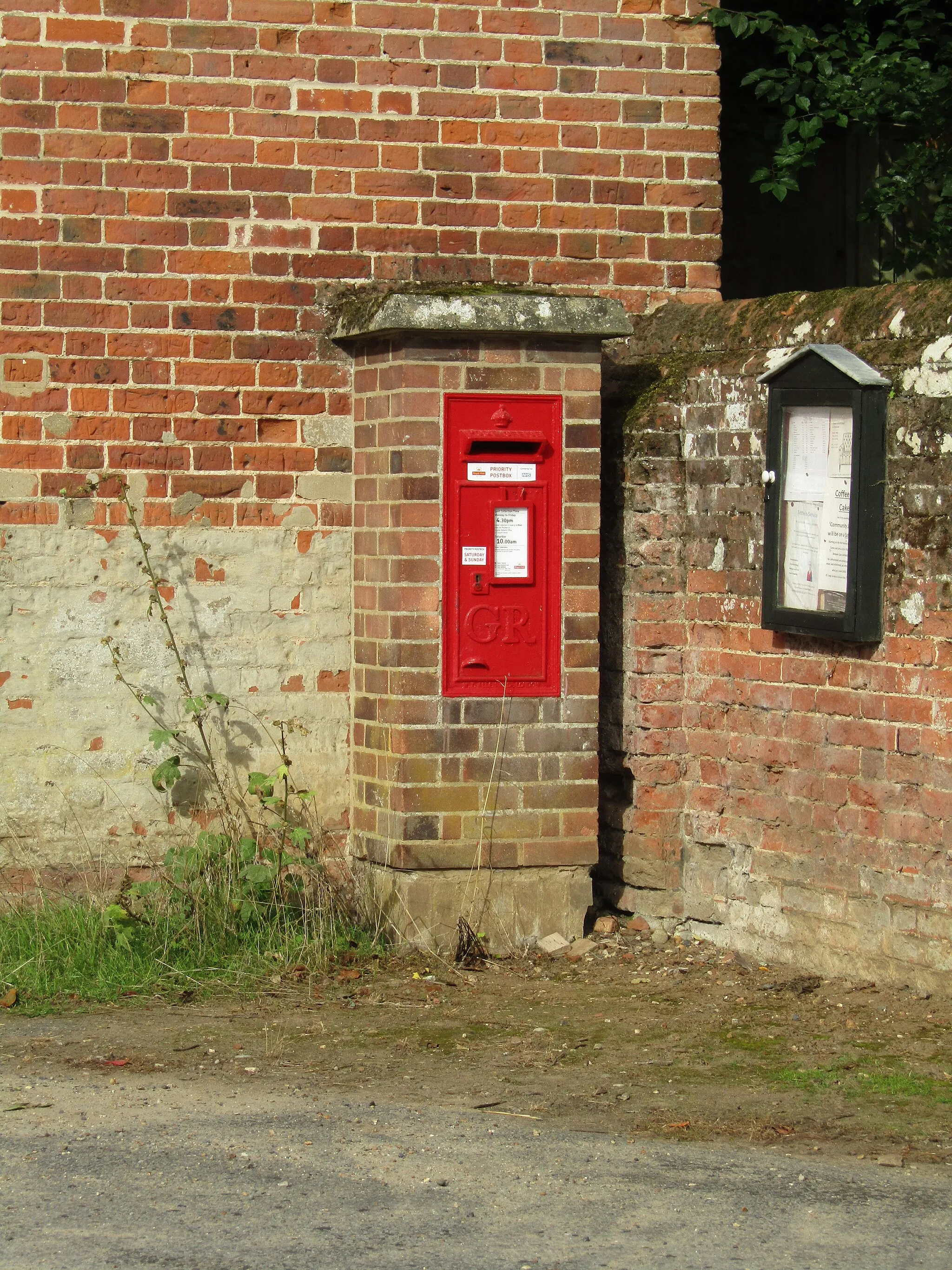 Photo showing: A Priority Red Postbox designated for returning COVID-19 home testing kits, located on 'The Street' located in the village of Little Barningham, Norfolk, England.