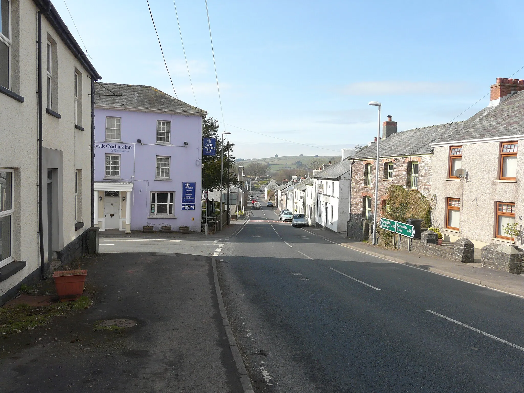 Photo showing: Looking northwest along the A40 through Trecastle. Chapel Street is the next road to the left.