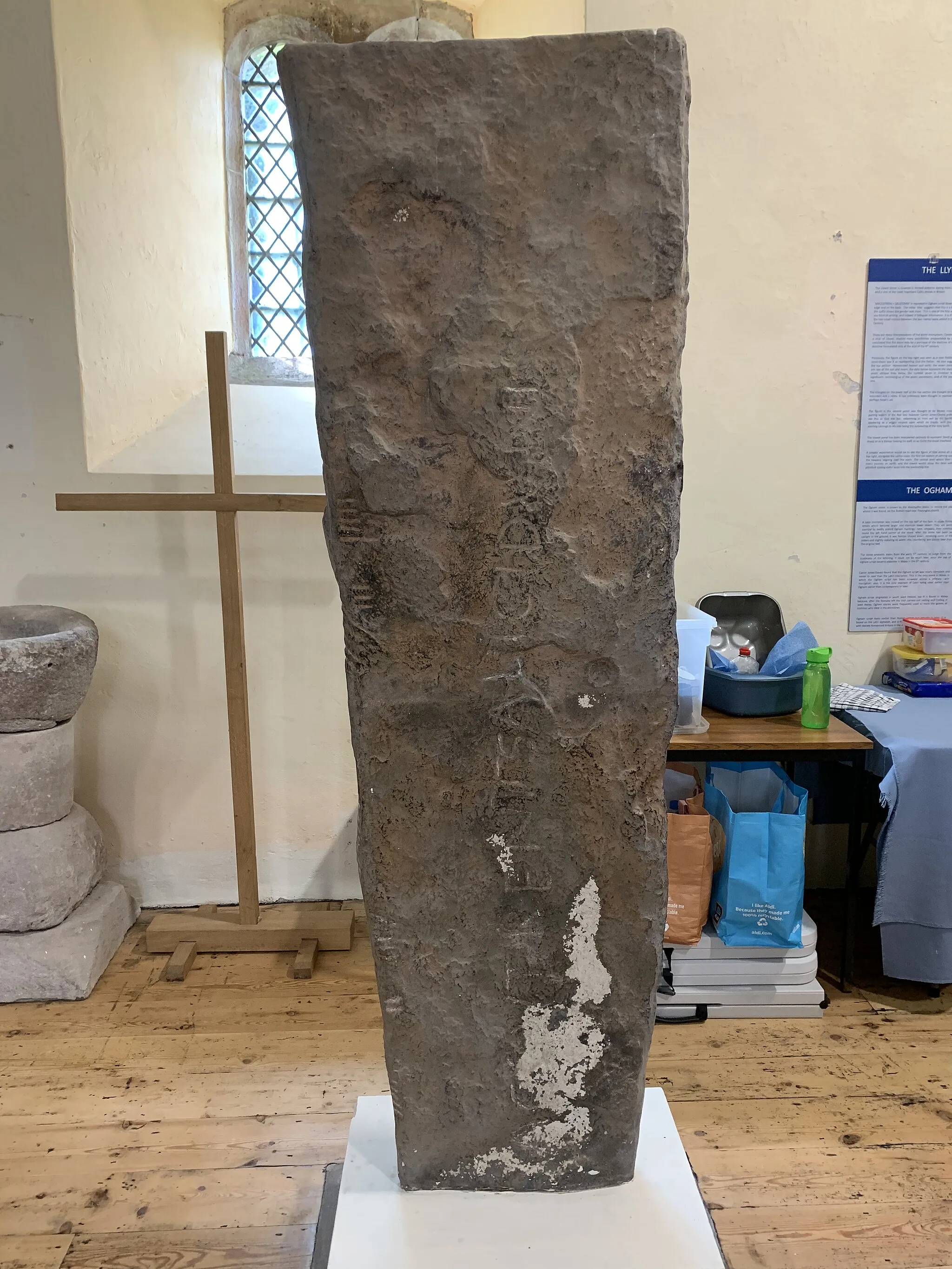Photo showing: Replica of the Llywel Stone, stored in St David's Church, Llywel. Another copy is held in the Brecon Museum and the original is held in the British Museum, London.