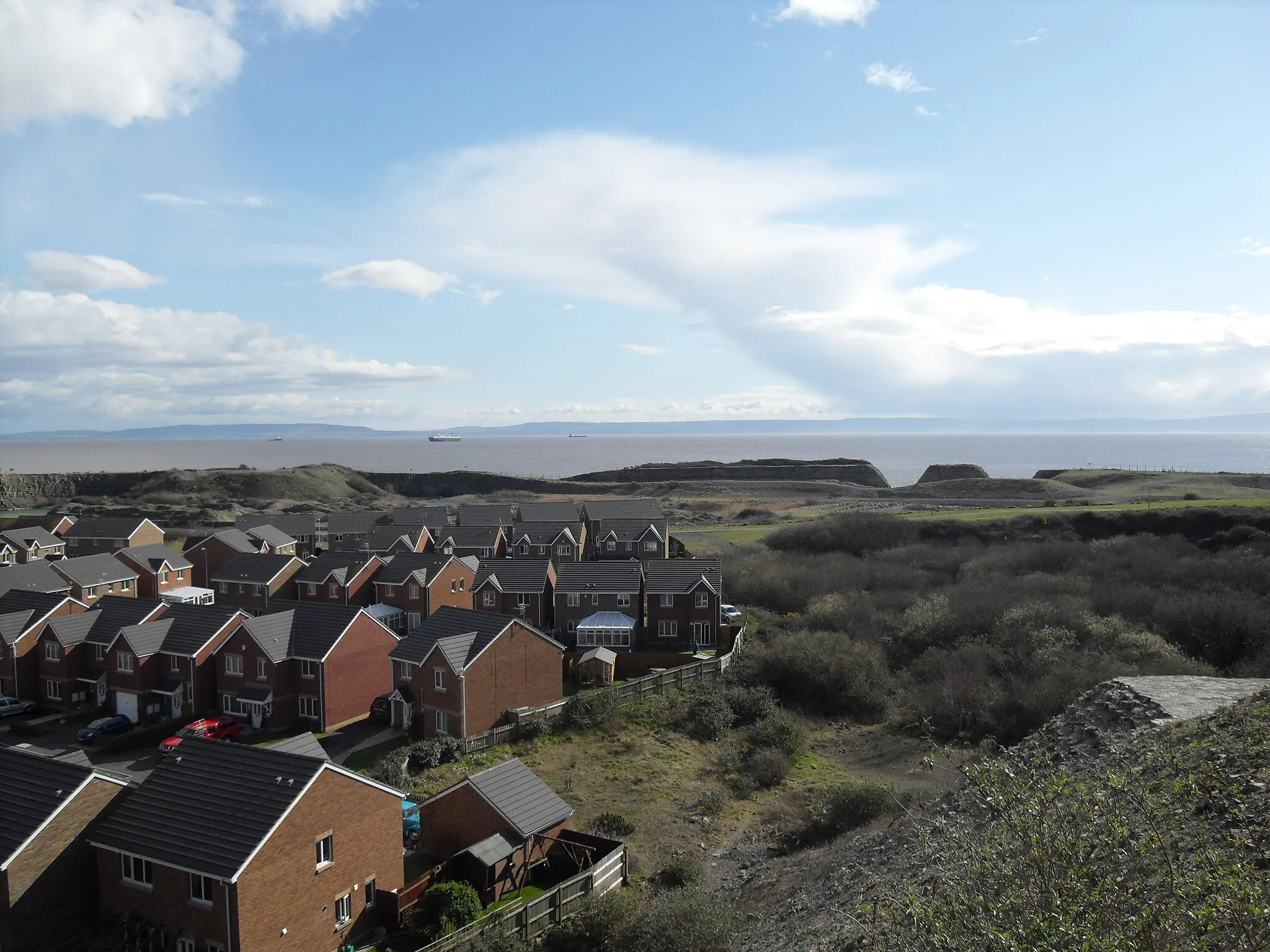 Photo showing: A view over part of Rhoose Point in Wales, facing Southeast with England visible in the distance, across the Bristol Channel