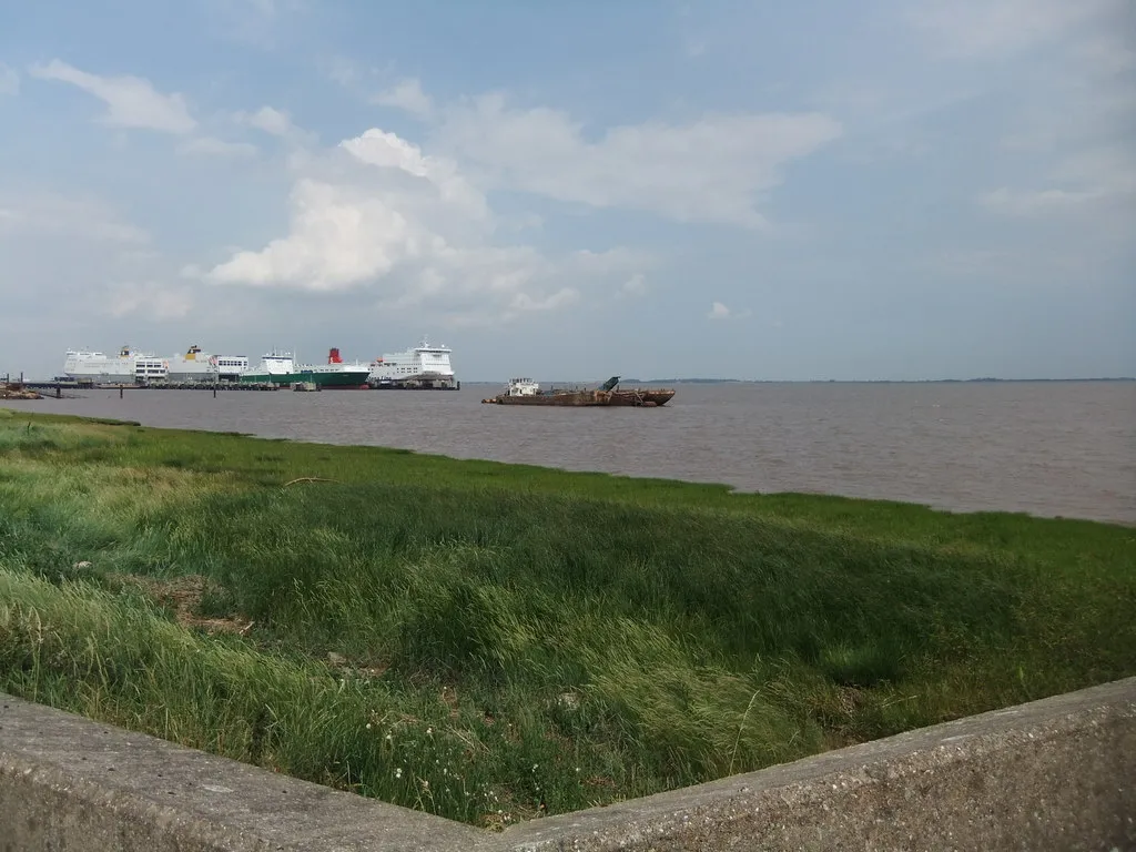 Photo showing: An old dredger lies at anchor