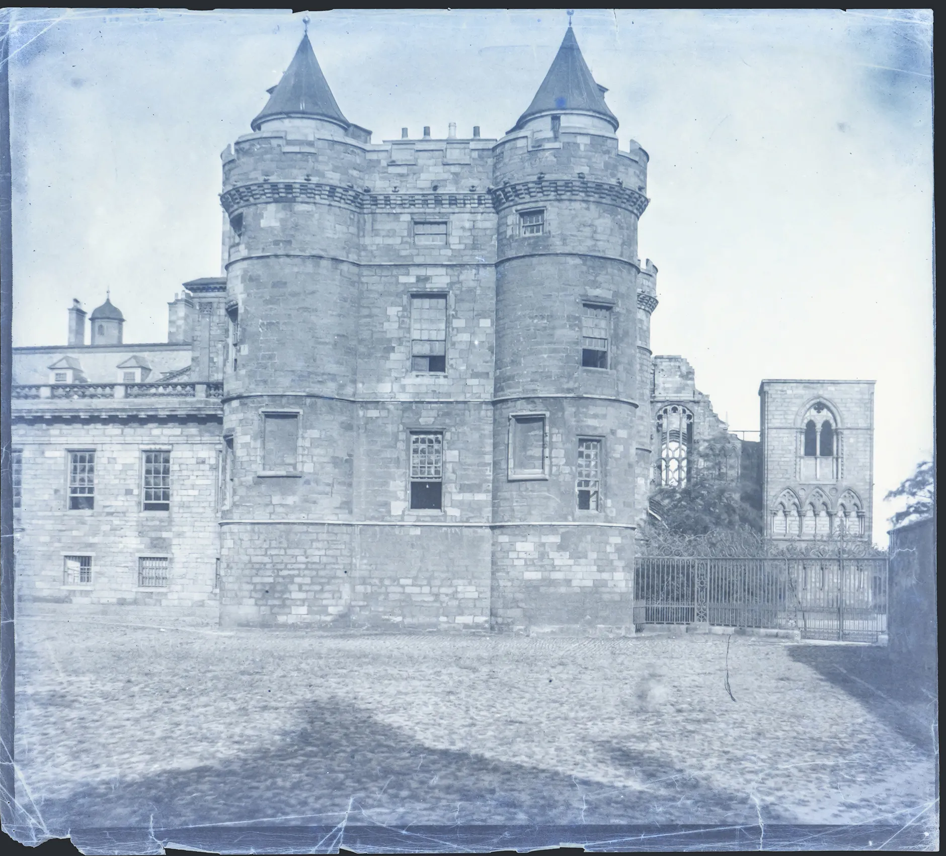 Photo showing: The negative shows the northwest tower of Holyrood Palace with the ruins of the abbey in the background.